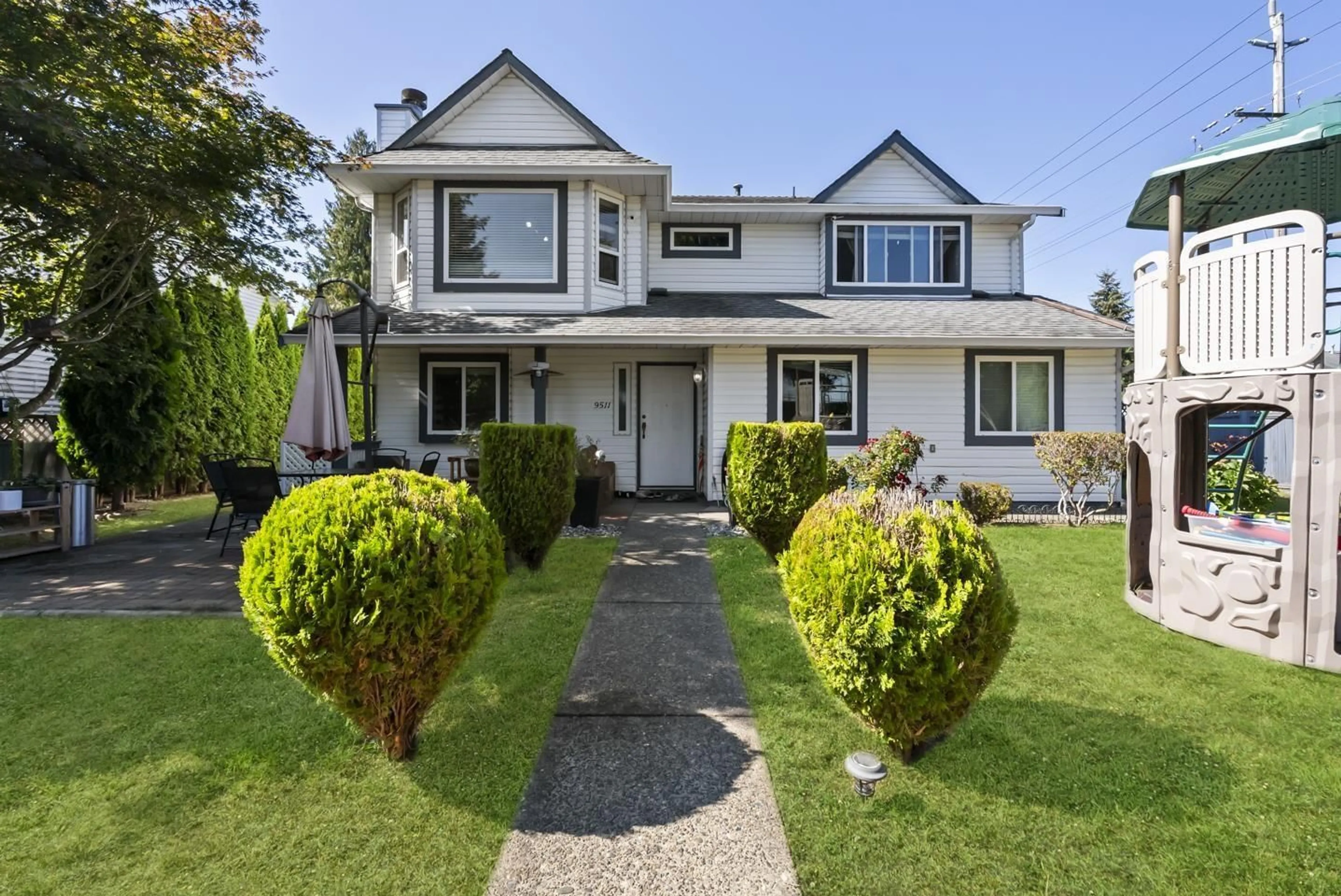 Home with vinyl exterior material, street for 9511 160 STREET, Surrey British Columbia V4N2N9