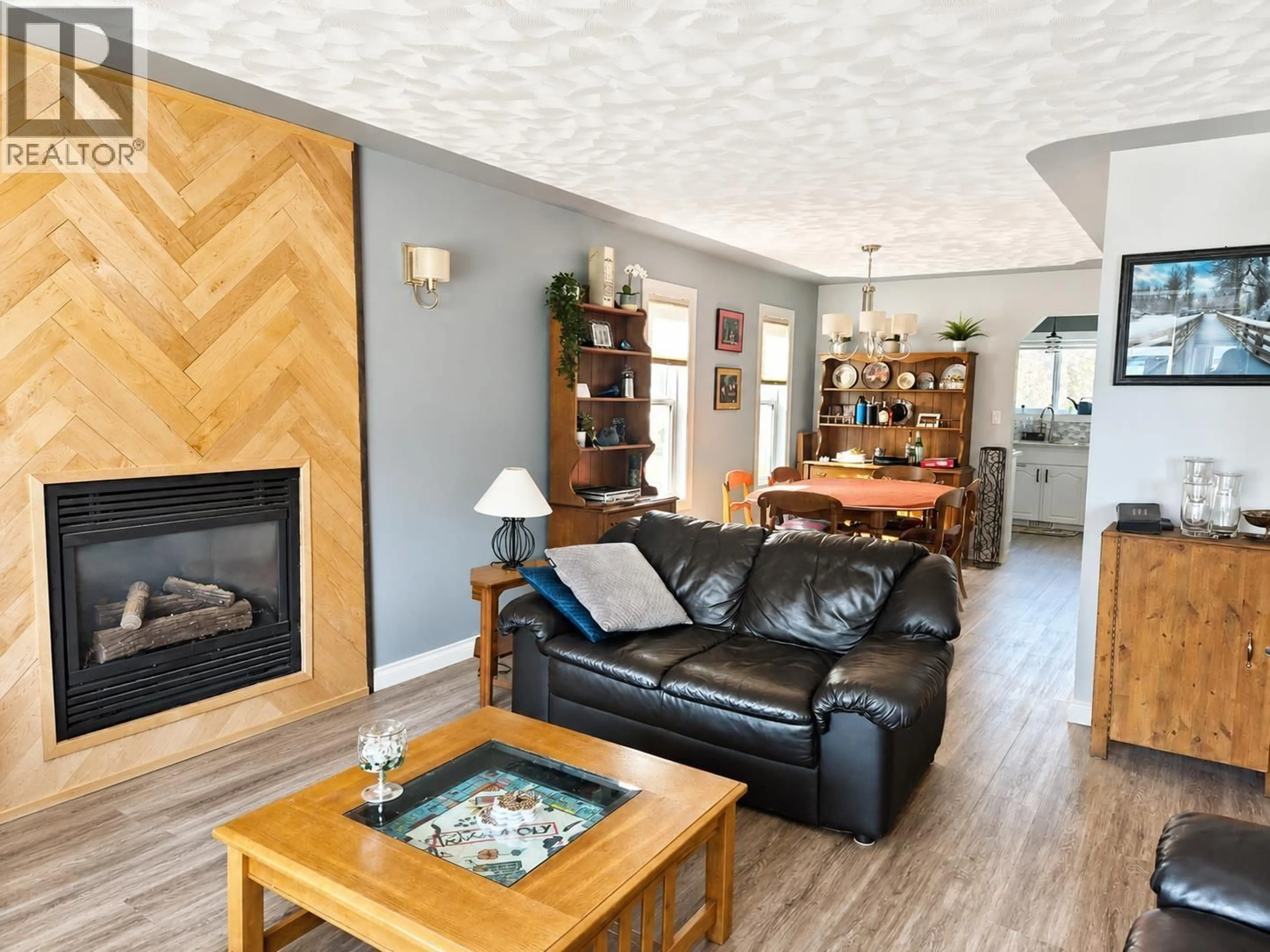 Living room with furniture, wood/laminate floor for 7623 ST MARY CRESCENT, Prince George British Columbia V2N4M3