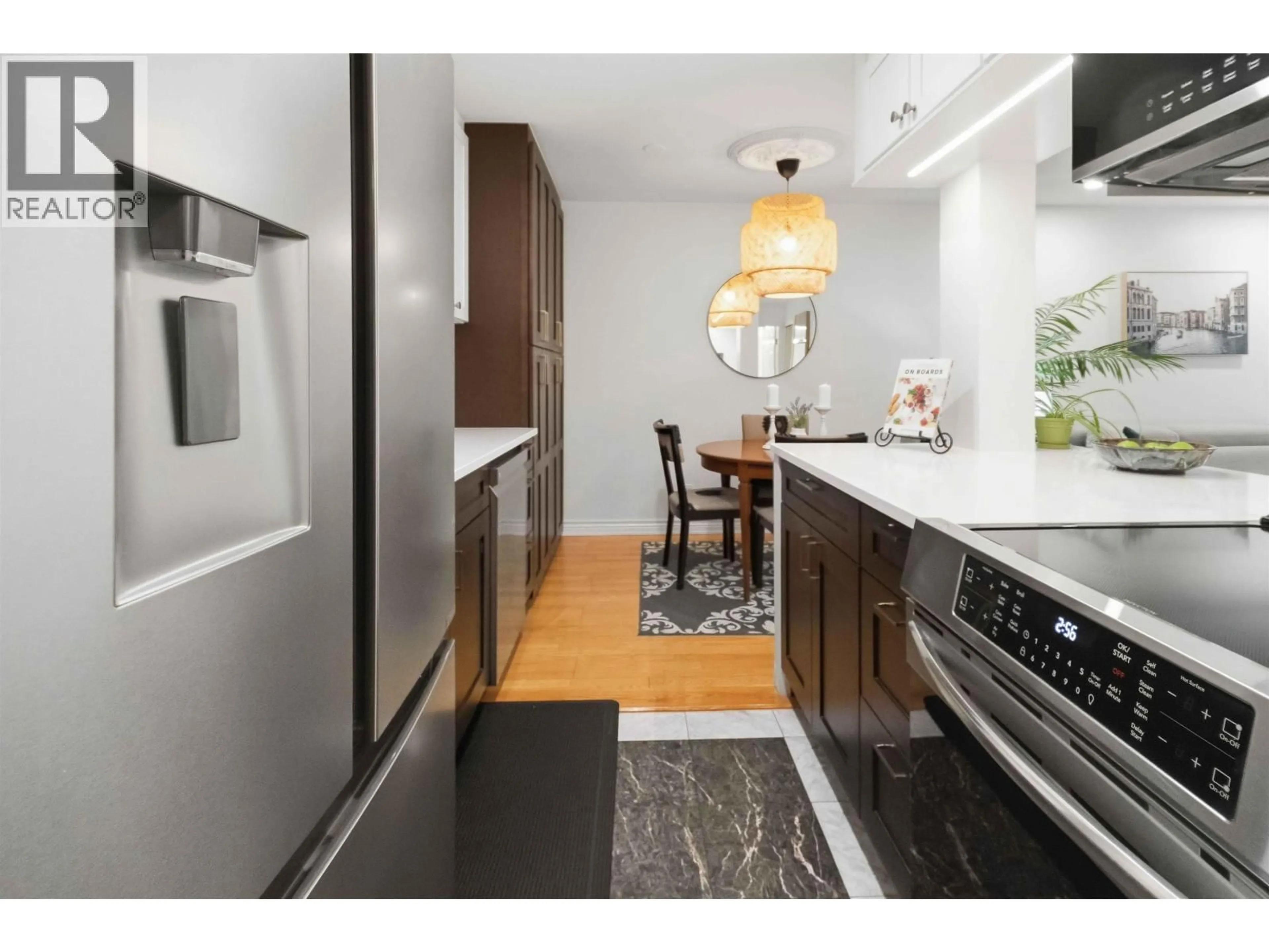 Contemporary kitchen, wood/laminate floor for 208 - 1422 3RD AVENUE, Vancouver British Columbia V5N5R5