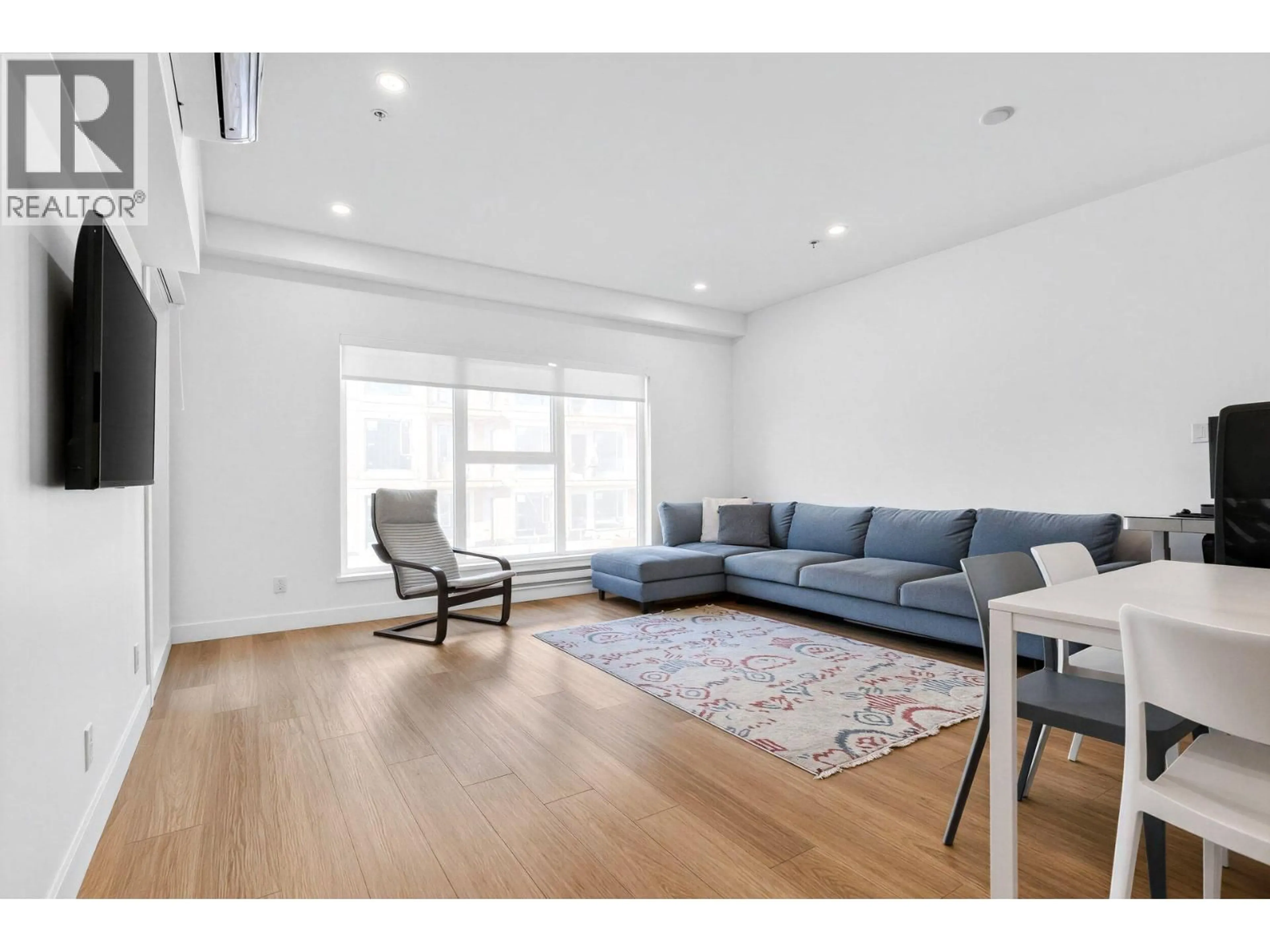 Living room with furniture, wood/laminate floor for 301 - 2331 KELLY AVENUE, Port Coquitlam British Columbia V3C1Y3