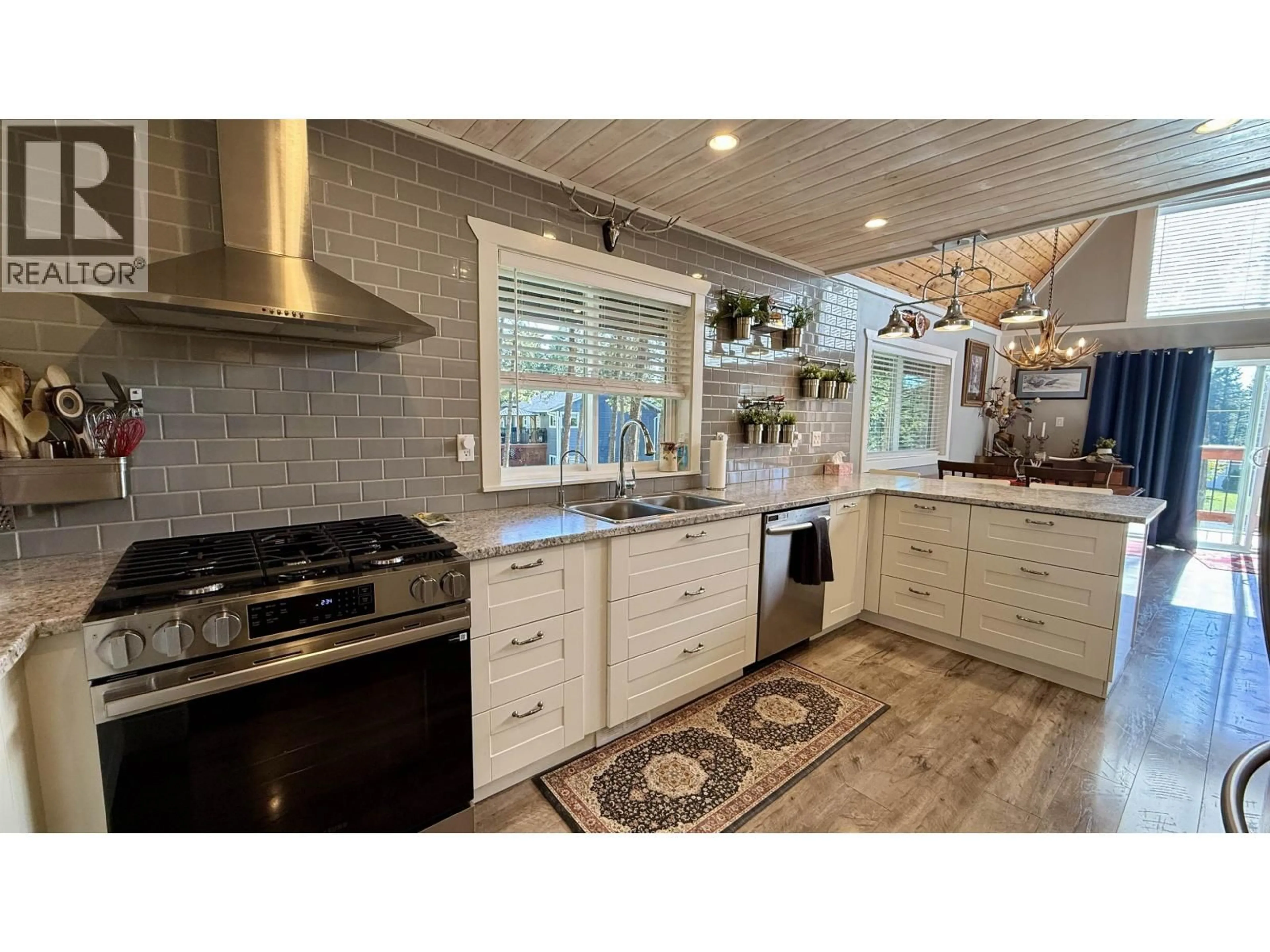 Open concept kitchen, ceramic/tile floor for 4867 GLOINNZUN DRIVE, 108 Mile Ranch British Columbia V0K2Z0