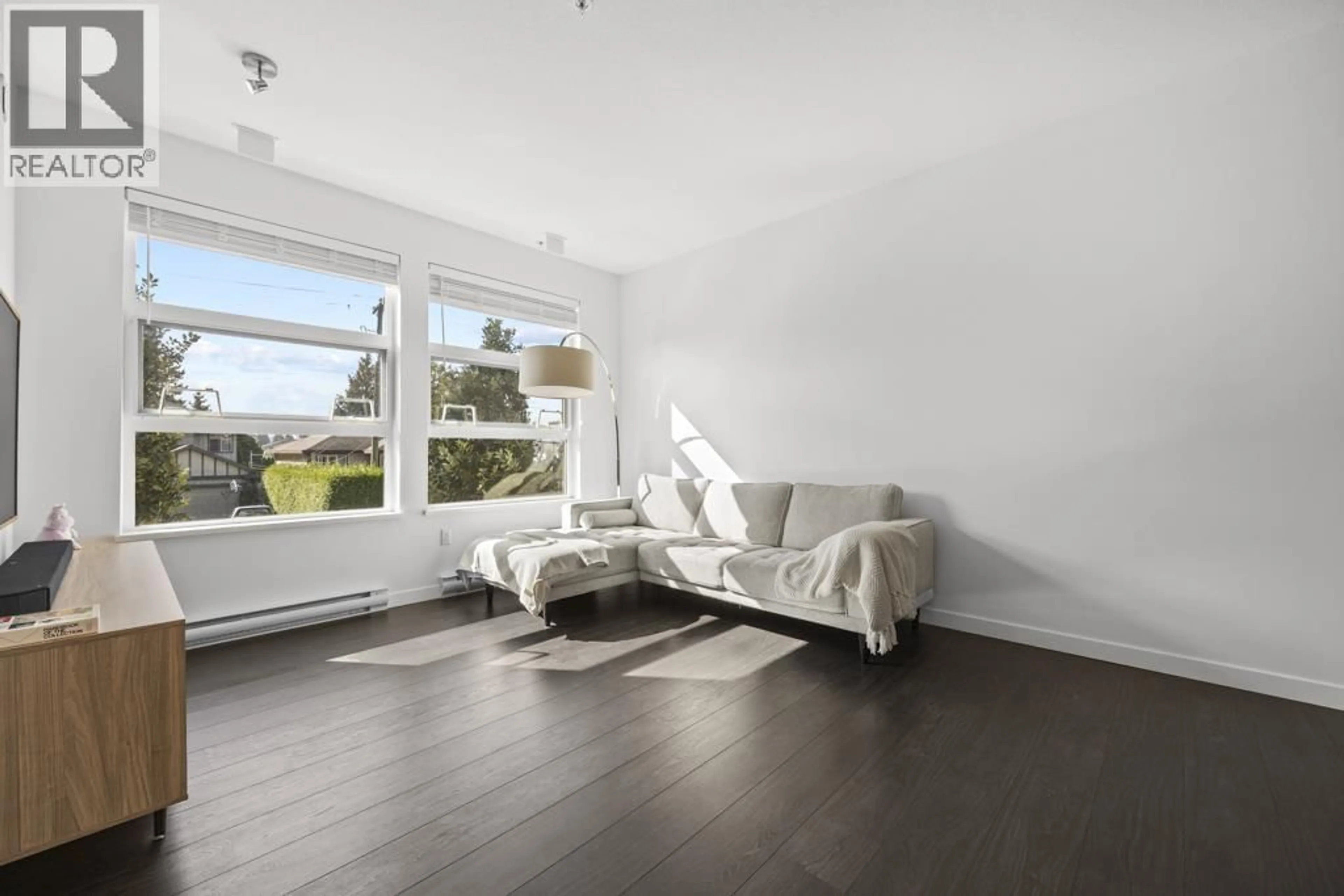 Living room with furniture, wood/laminate floor for 216 - 607 COTTONWOOD AVENUE, Coquitlam British Columbia V3J0H1