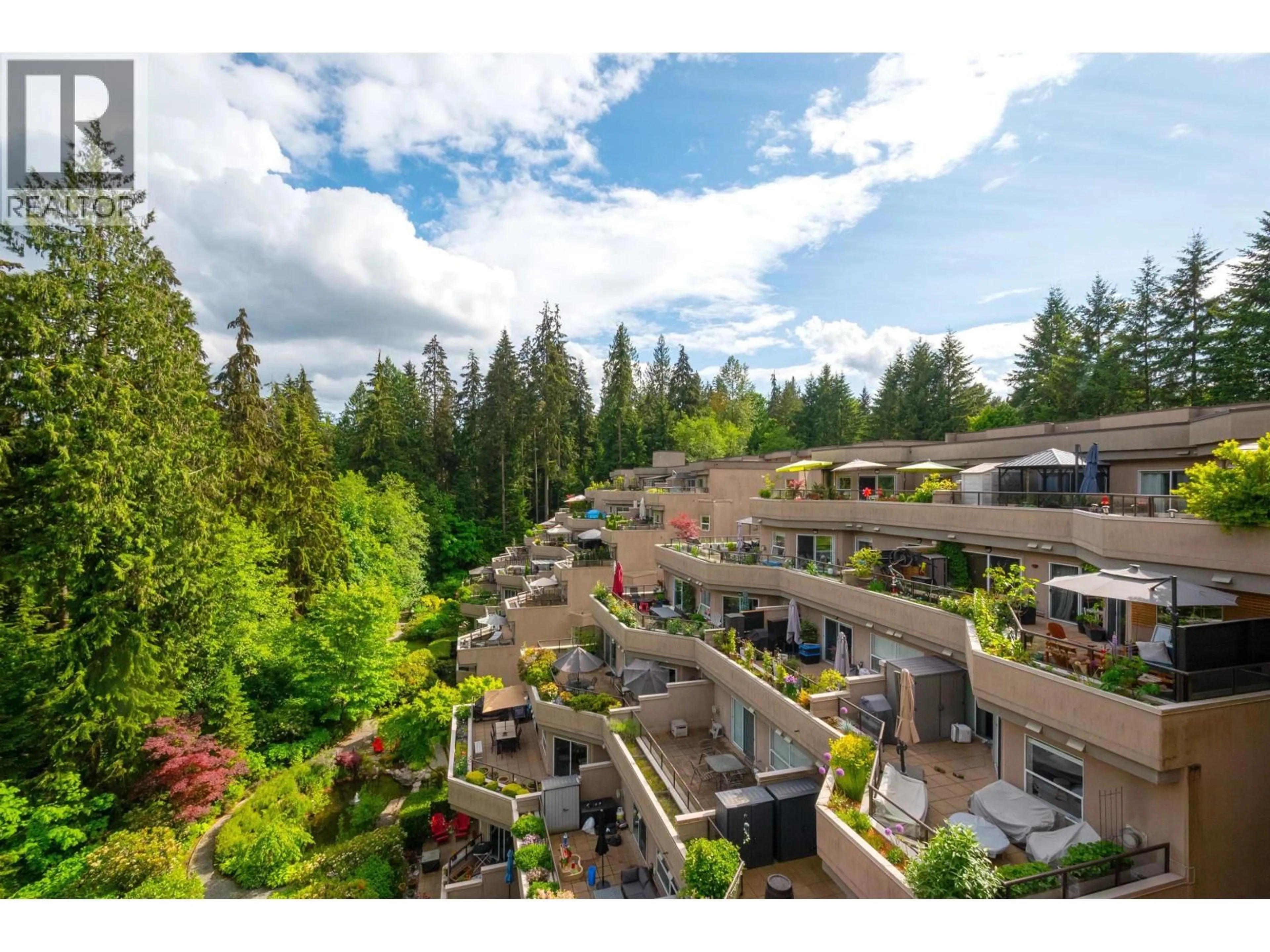 A pic from outside/outdoor area/front of a property/back of a property/a pic from drone, forest/trees view for 706 - 1500 OSTLER COURT, North Vancouver British Columbia V7G2S2