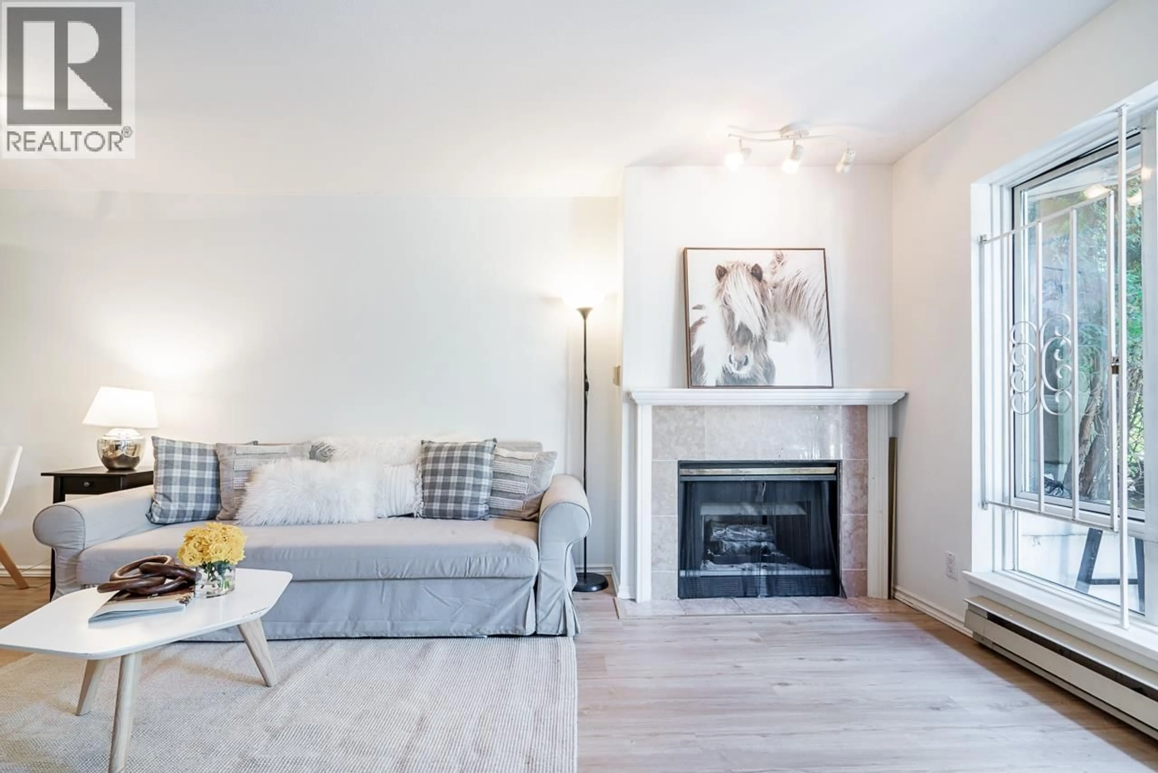 Living room with furniture, wood/laminate floor for 105 - 2195 5TH AVENUE, Vancouver British Columbia V6K1S1