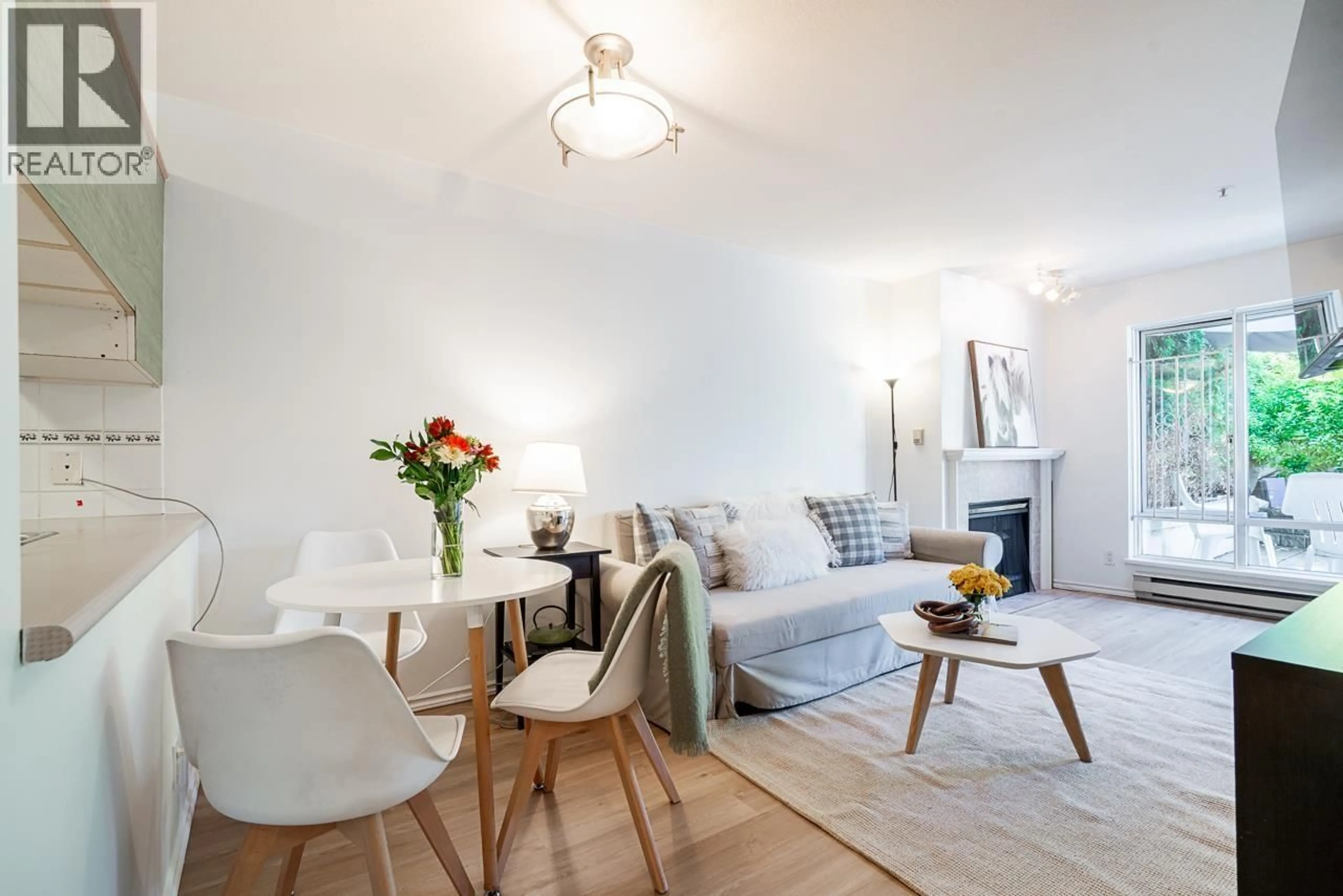 Living room with furniture, wood/laminate floor for 105 - 2195 5TH AVENUE, Vancouver British Columbia V6K1S1