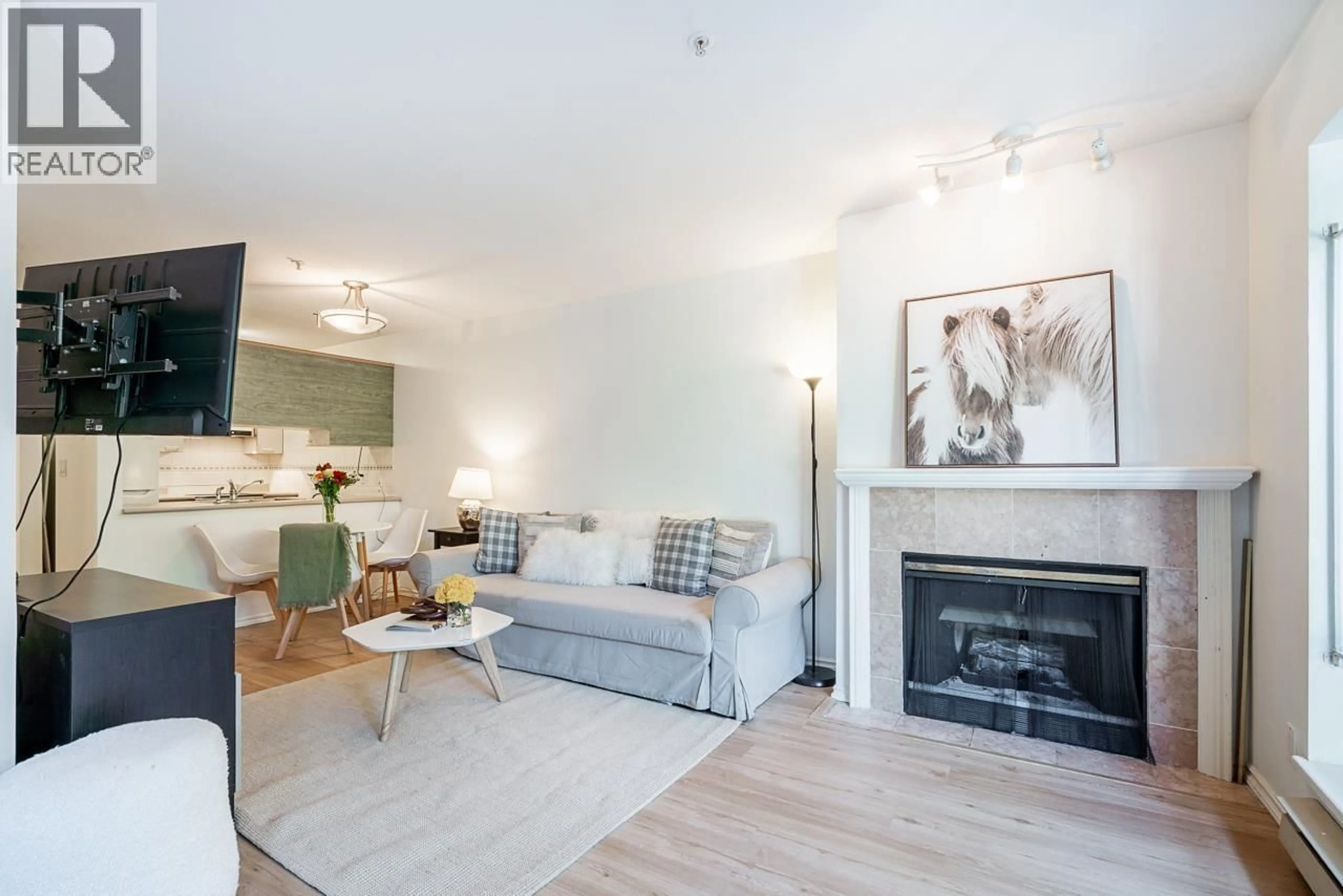 Living room with furniture, wood/laminate floor for 105 - 2195 5TH AVENUE, Vancouver British Columbia V6K1S1
