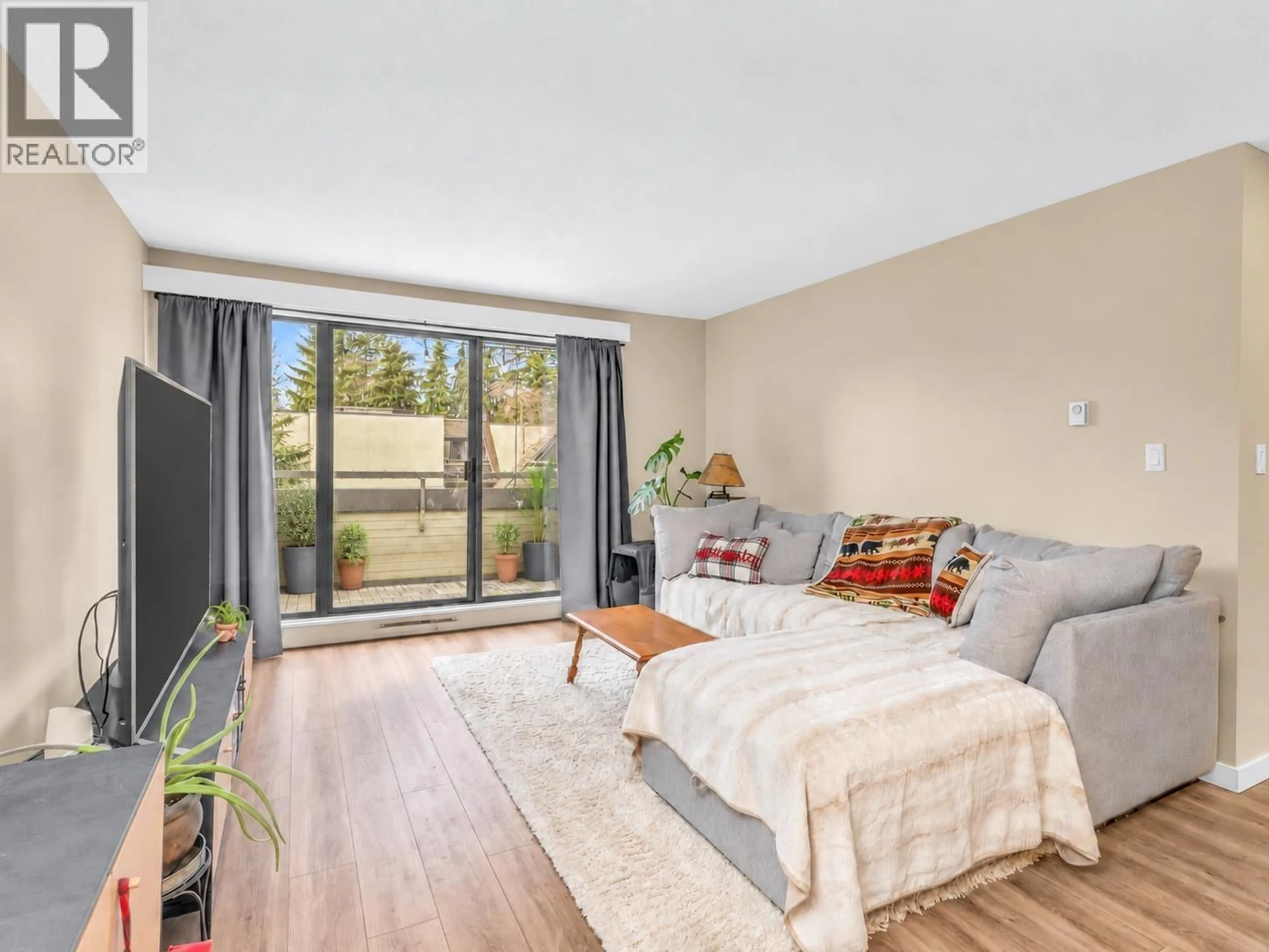 Living room with furniture, wood/laminate floor for 417 - 1210 PACIFIC STREET, Coquitlam British Columbia V3B6K3