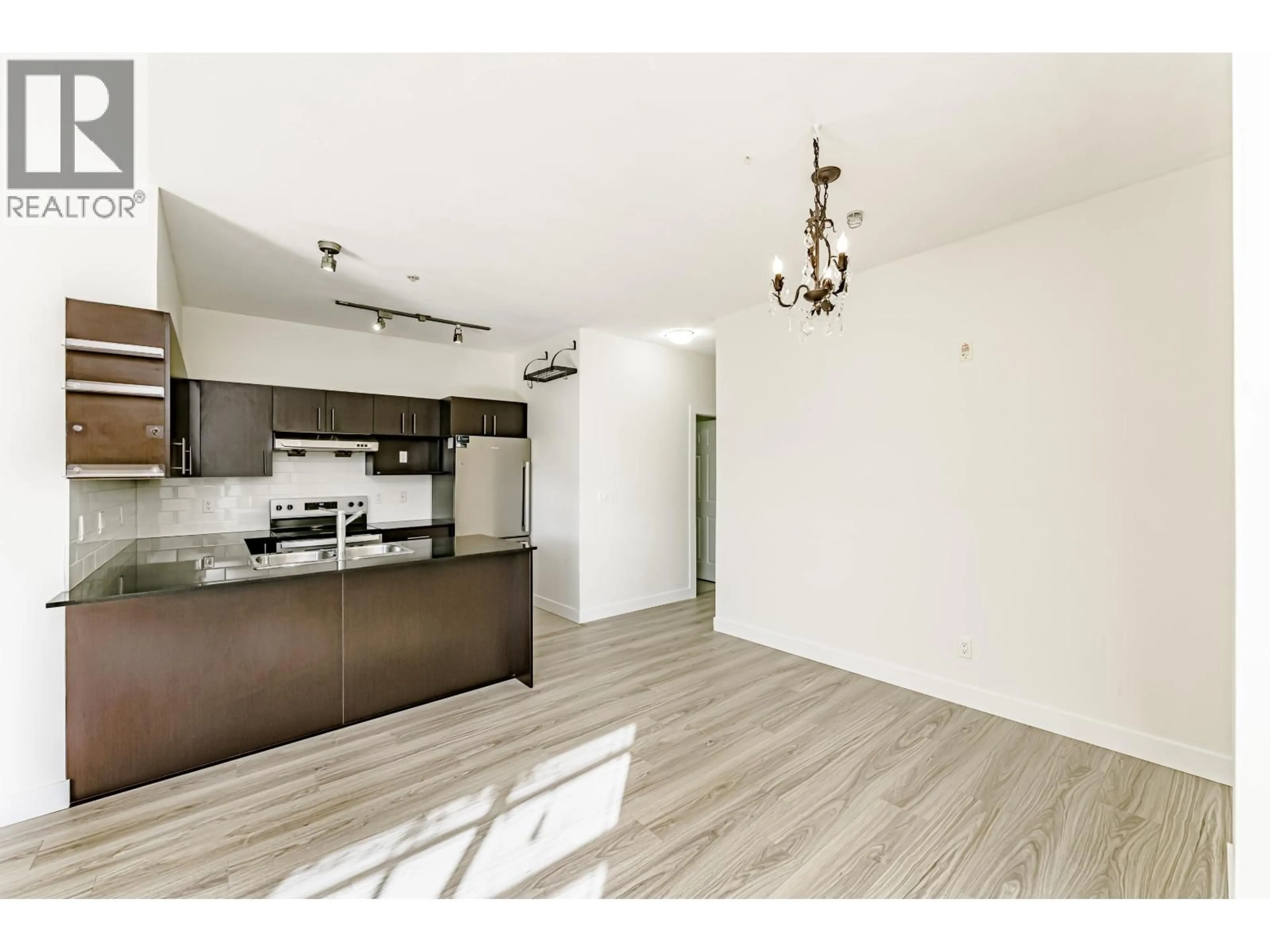 Open concept kitchen, wood/laminate floor for 107 - 1633 MACKAY AVENUE, North Vancouver British Columbia V7P0A2