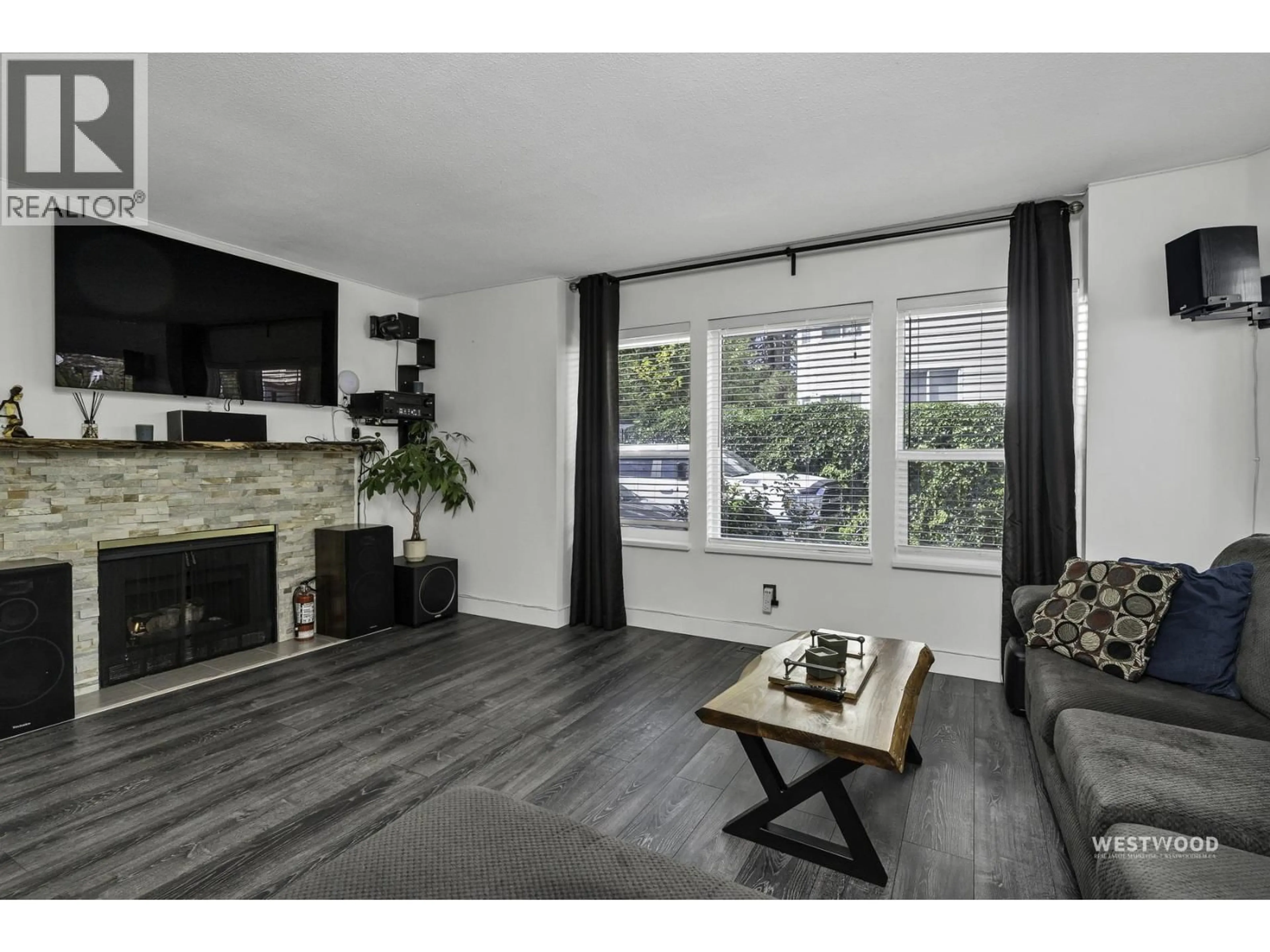 Living room with furniture, wood/laminate floor for 1 - 19236 119 AVENUE, Pitt Meadows British Columbia V3Y2E8