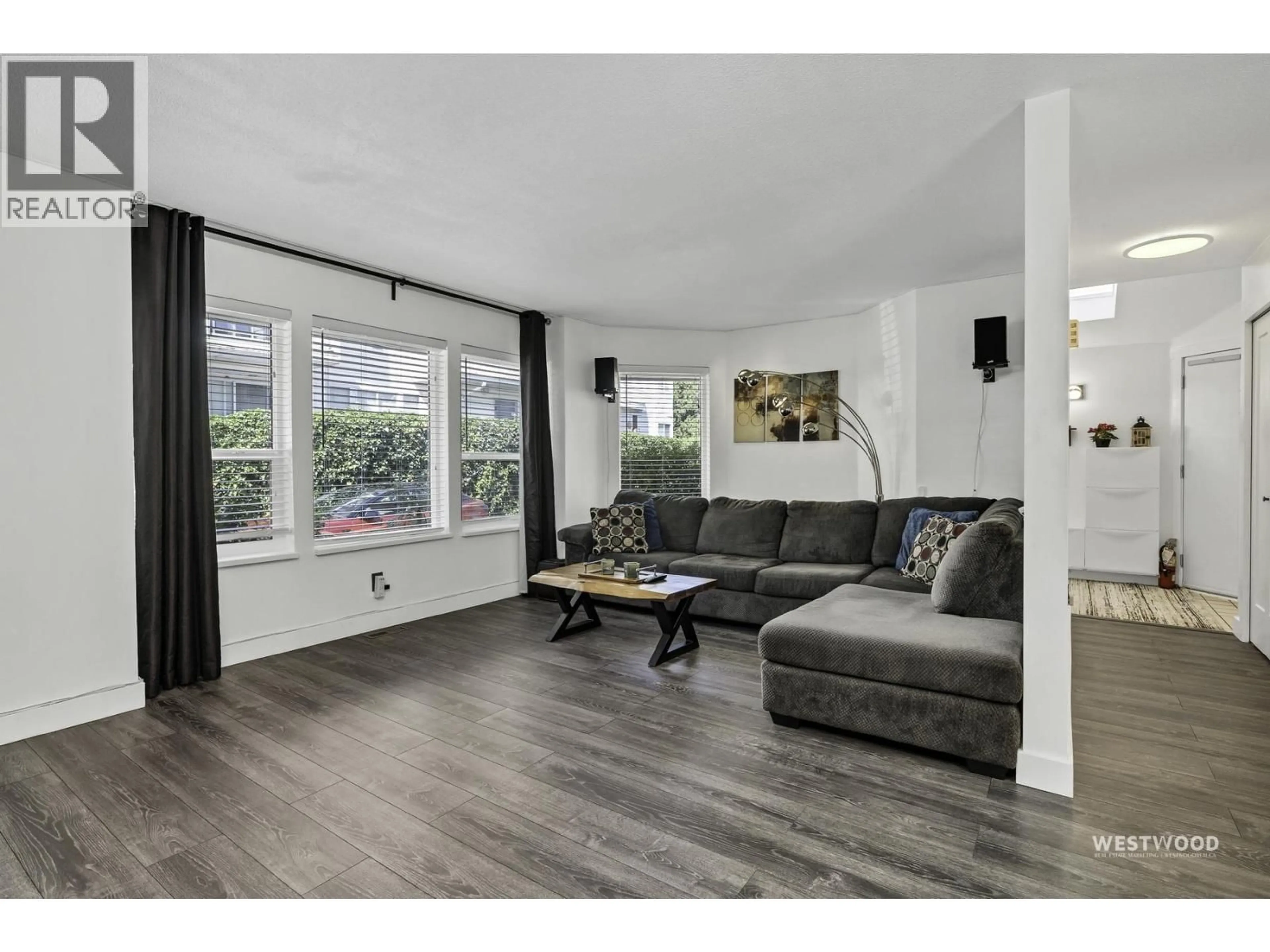 Living room with furniture, wood/laminate floor for 1 - 19236 119 AVENUE, Pitt Meadows British Columbia V3Y2E8