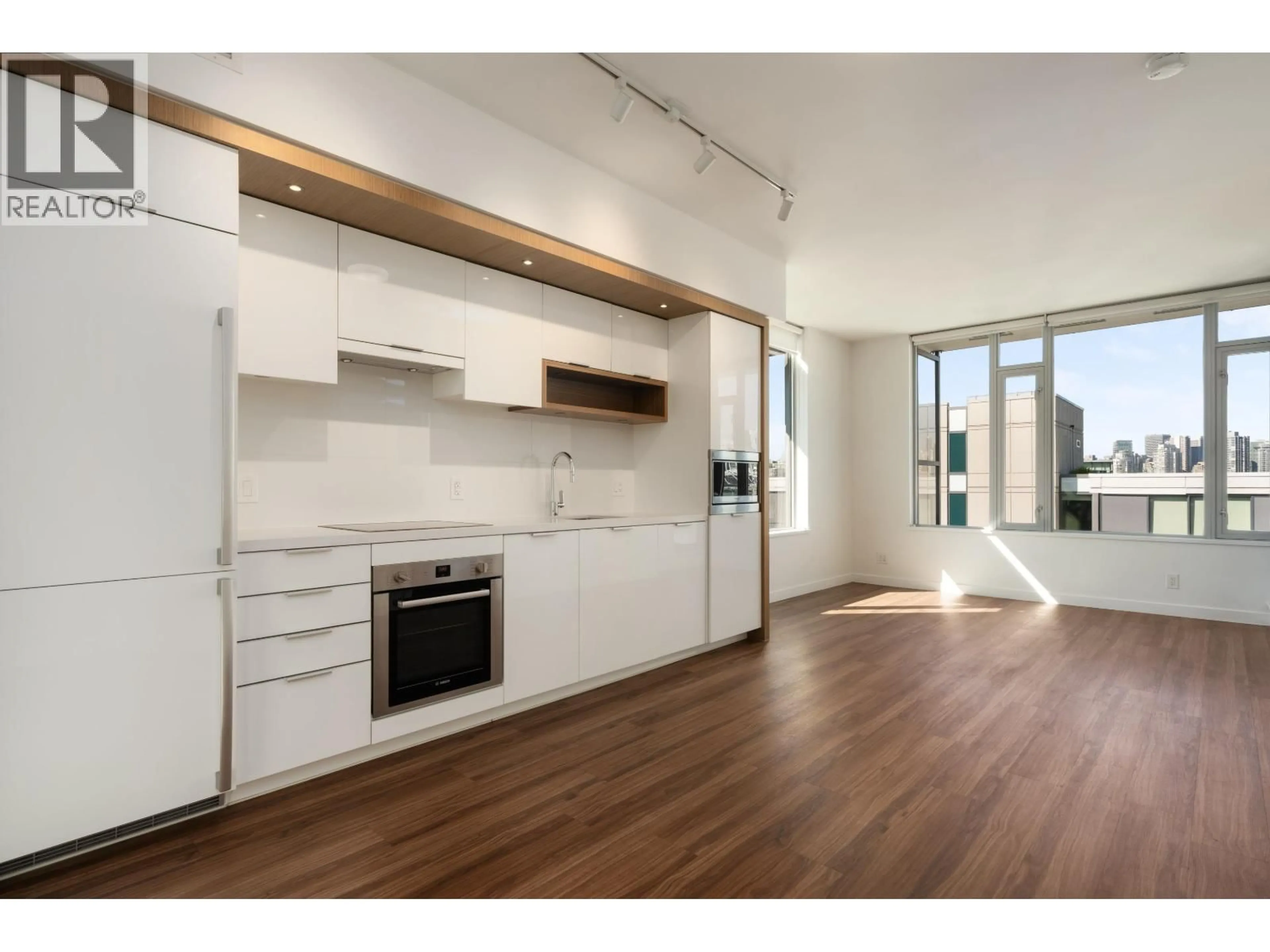 Open concept kitchen, wood/laminate floor for 1408 - 1661 QUEBEC STREET, Vancouver British Columbia V6A0H2