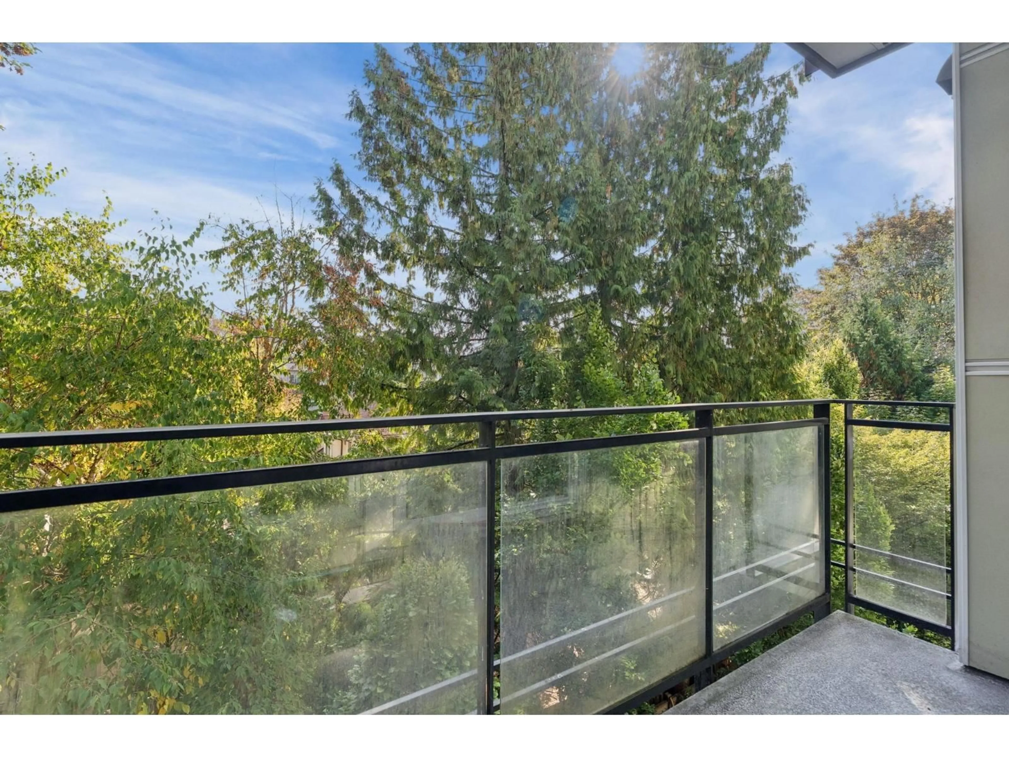 Balcony in the apartment, forest/trees view for 307 - 13919 FRASER HIGHWAY, Surrey British Columbia V3T4E6