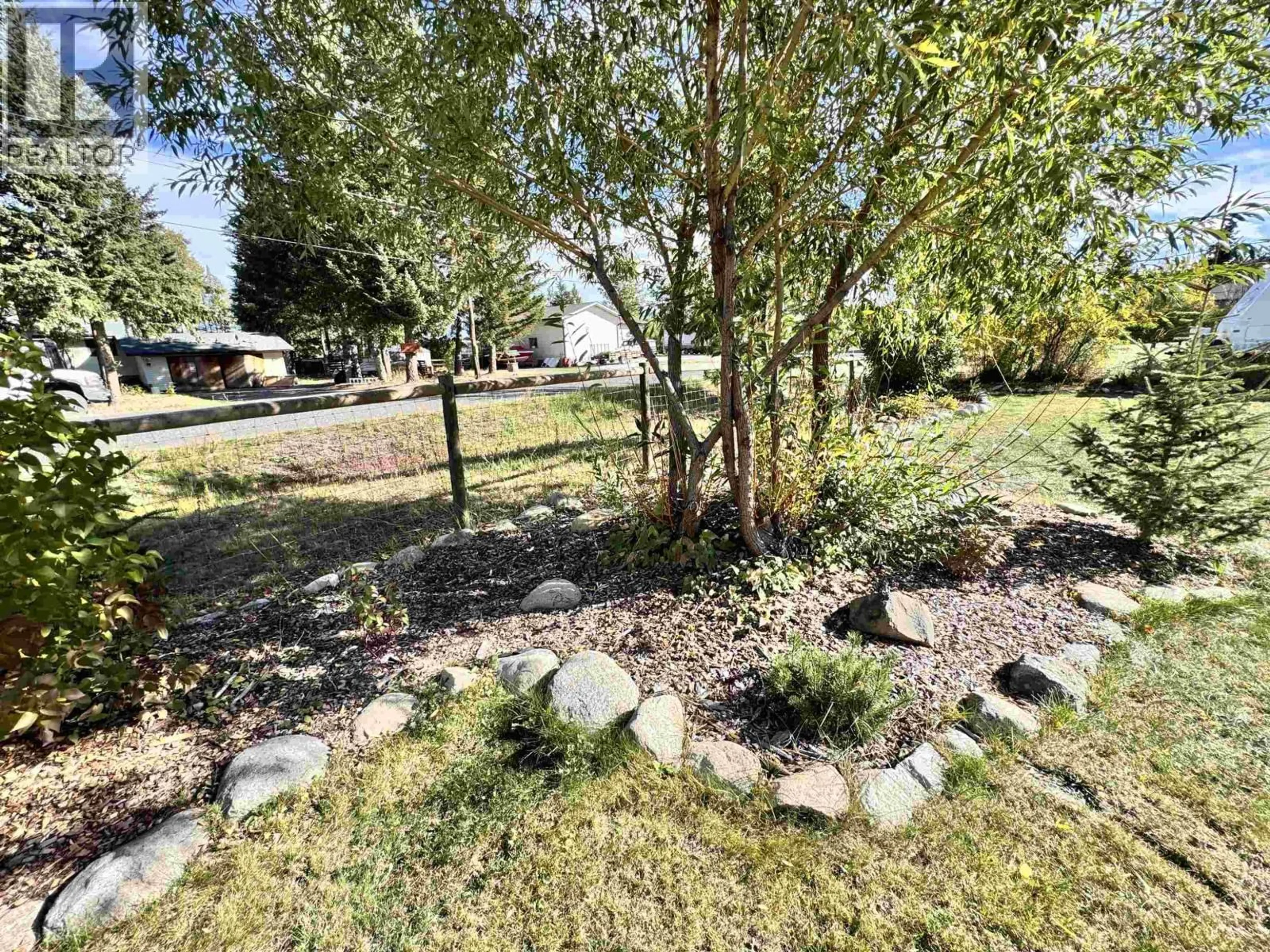A pic from outside/outdoor area/front of a property/back of a property/a pic from drone, street for 6494 GREY CRESCENT, Horse Lake British Columbia V0K2E3