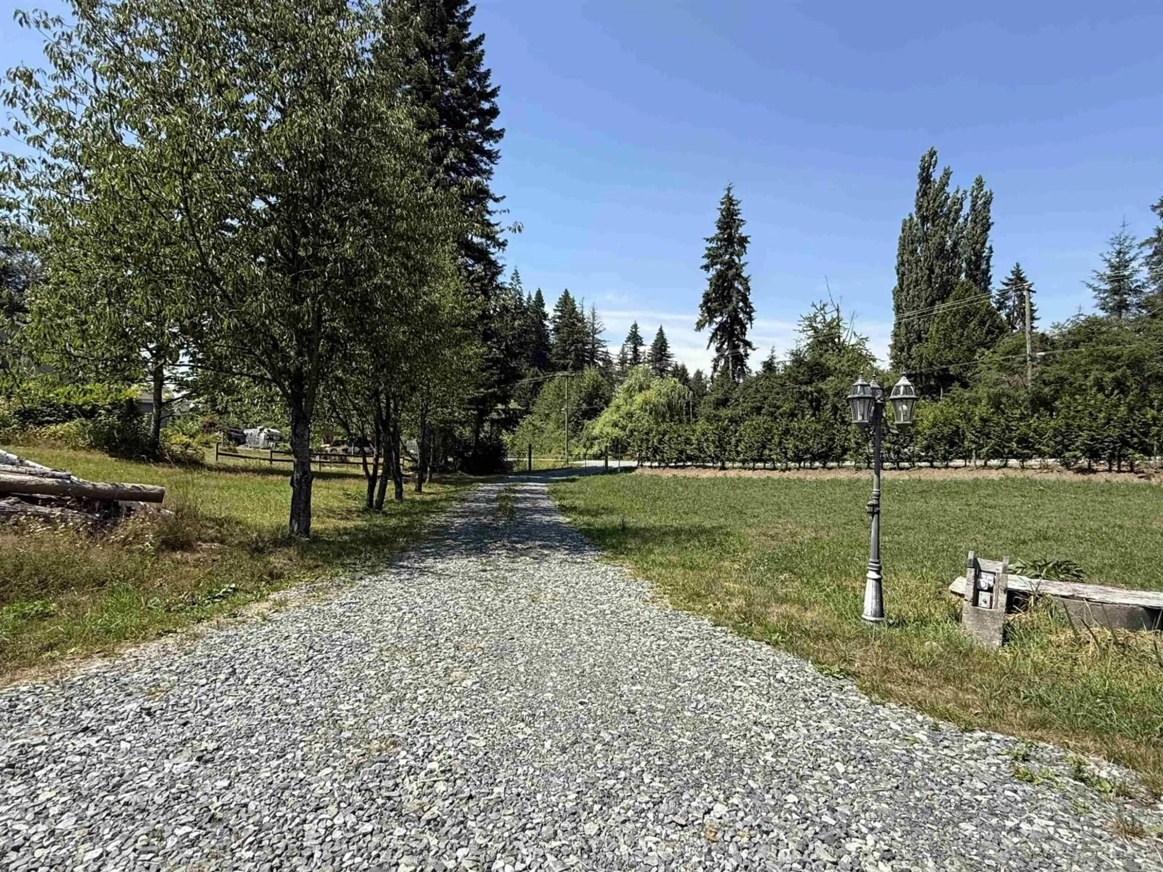 A pic from outside/outdoor area/front of a property/back of a property/a pic from drone, forest/trees view for 22134 96 AVENUE, Langley British Columbia V1M3T8