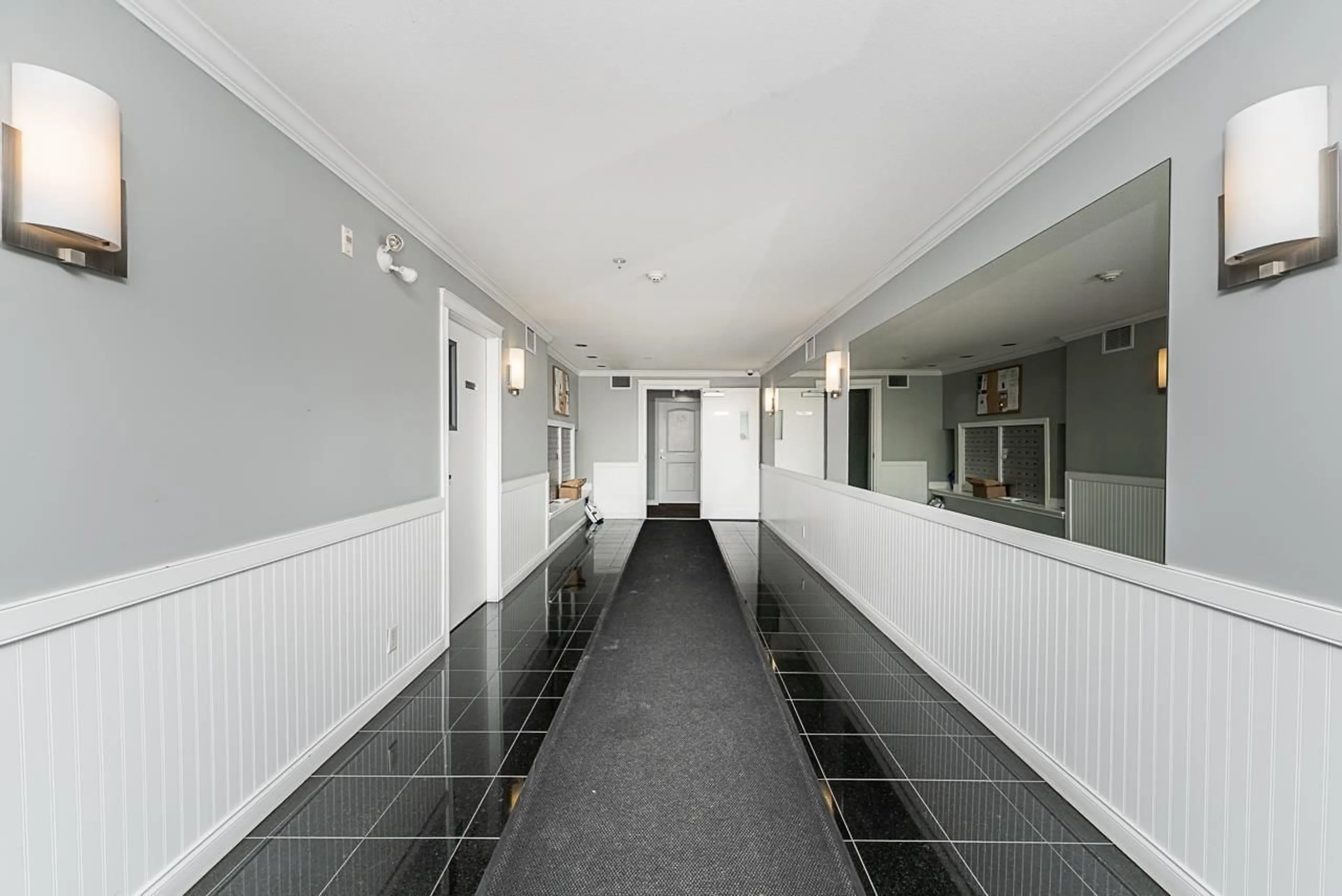 Indoor foyer for 407 - 19939 55A AVENUE, Langley British Columbia V3A3X4