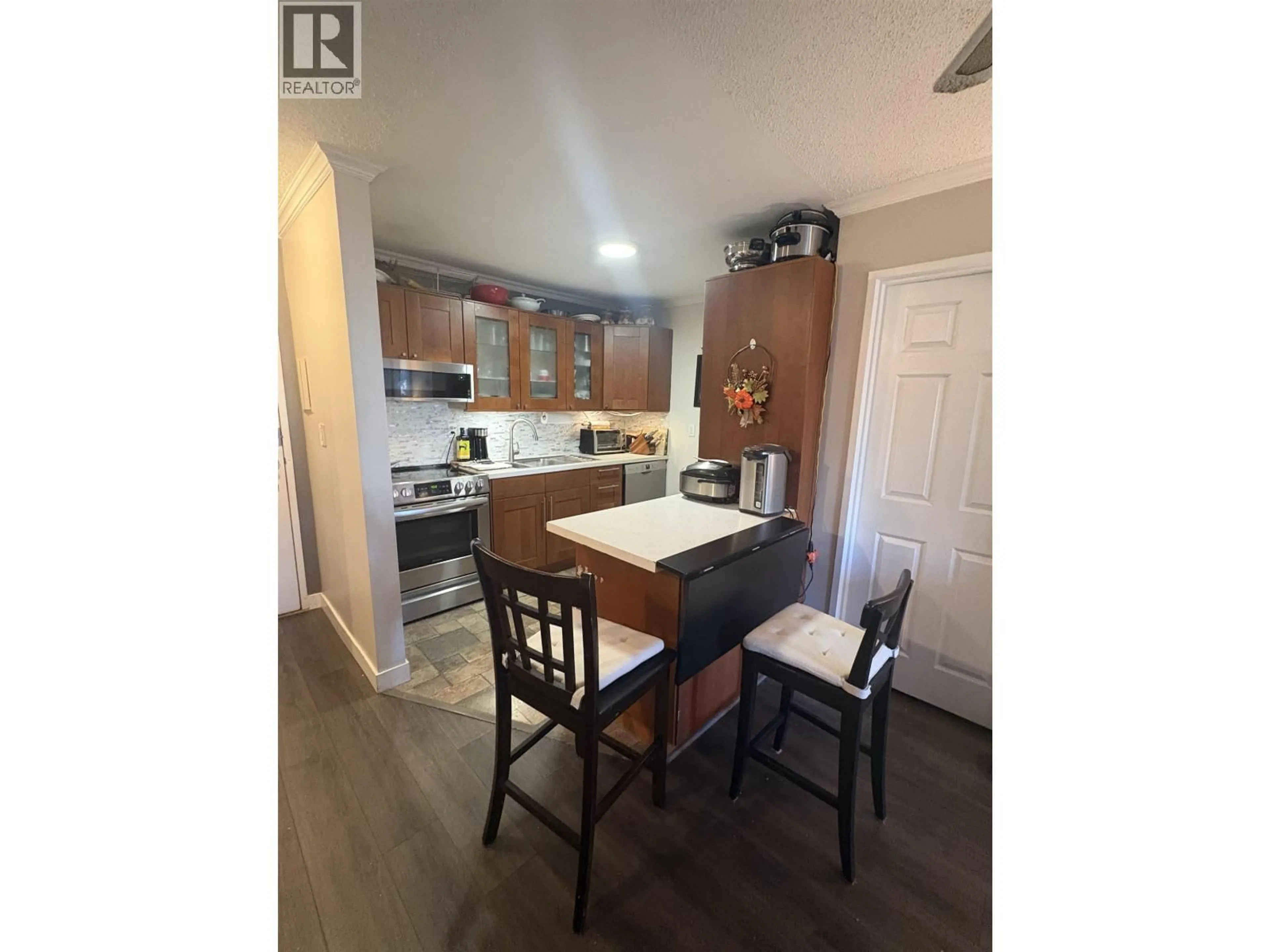 Open concept kitchen, wood/laminate floor for 205 - 1122 KING ALBERT AVENUE, Coquitlam British Columbia V3J1X7