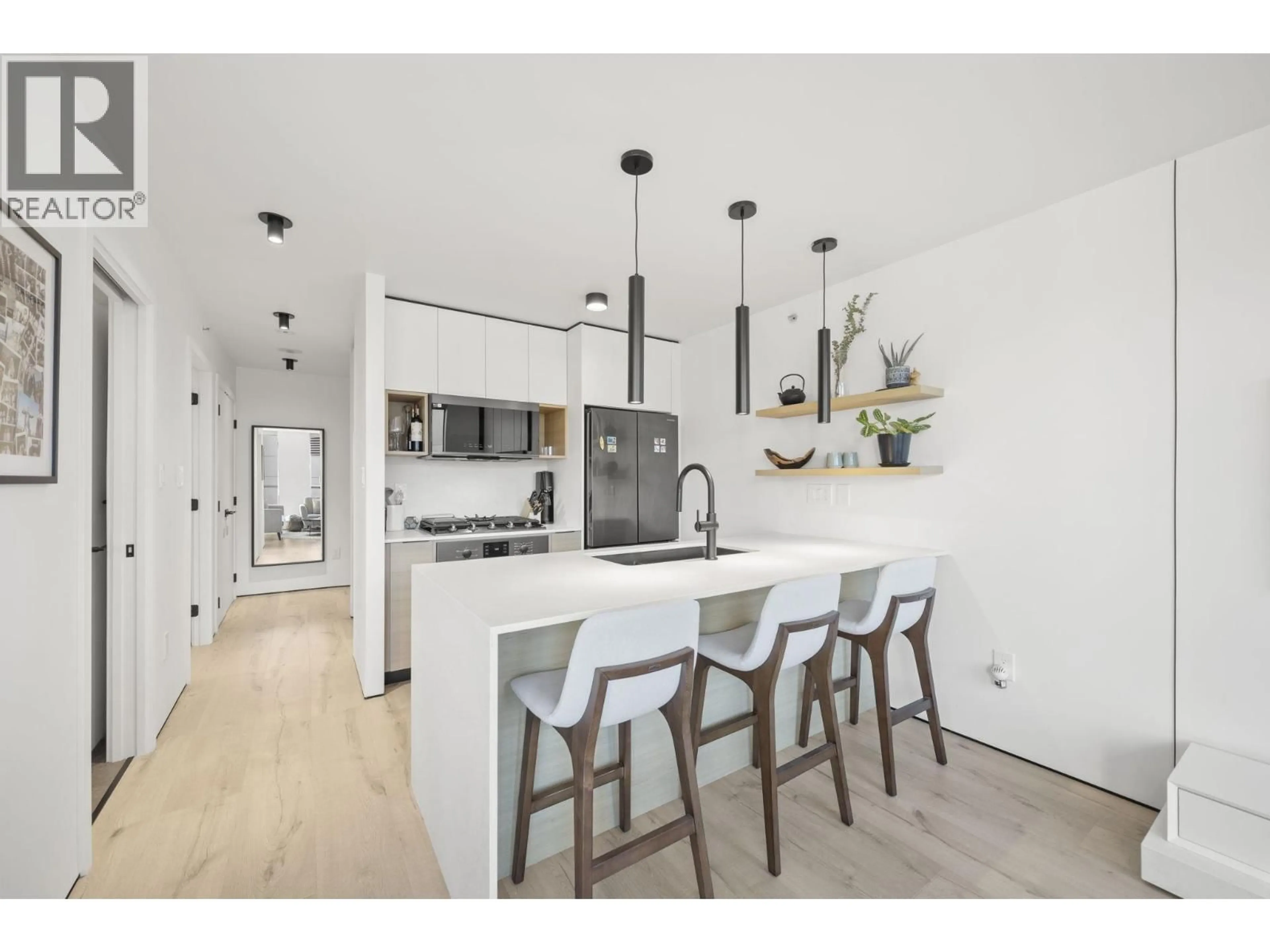 Open concept kitchen, wood/laminate floor for 502 - 2979 GLEN DRIVE, Coquitlam British Columbia V3B0B2