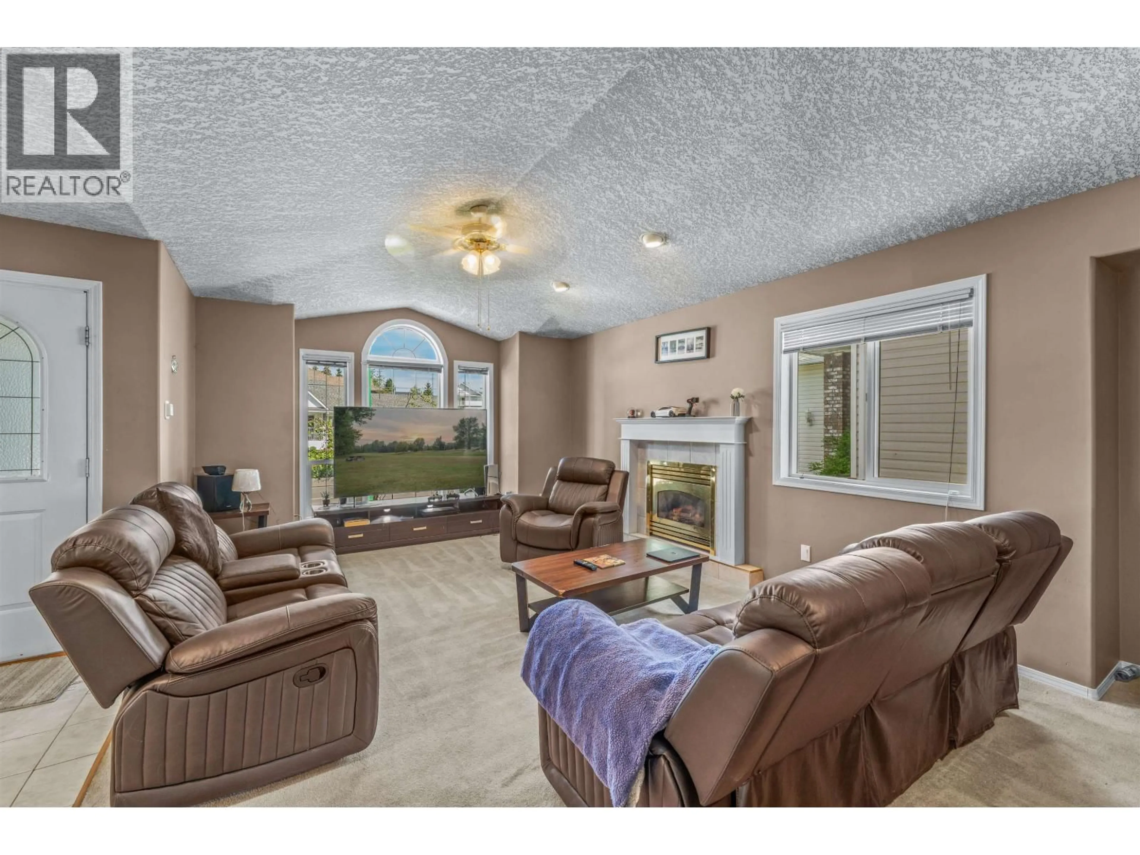 Living room with furniture, ceramic/tile floor for 6857 WESTGATE AVENUE, Prince George British Columbia V2N5R2