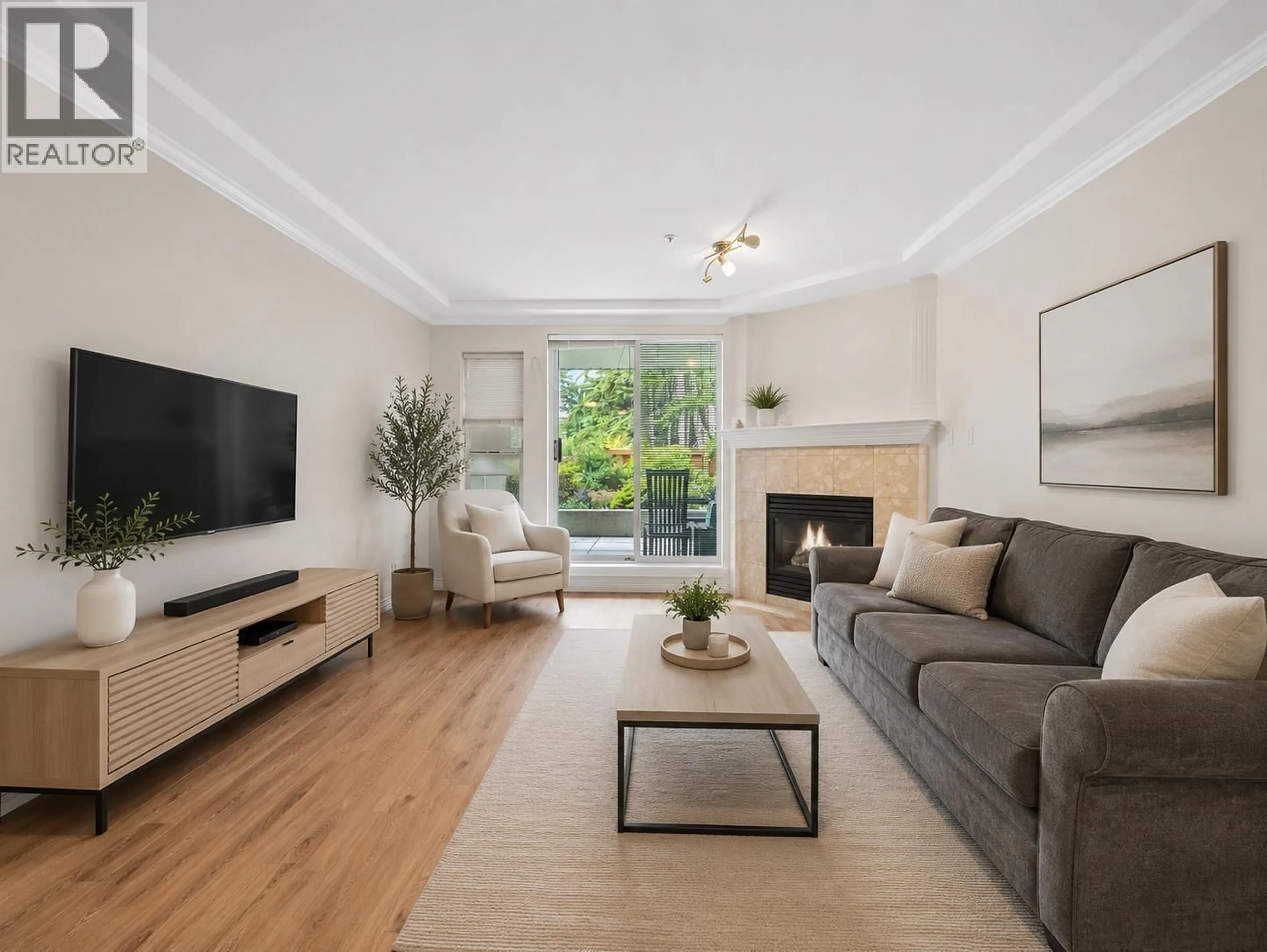 Living room with furniture, wood/laminate floor for 104 - 1281 PARKGATE AVENUE, North Vancouver British Columbia V7H3A3