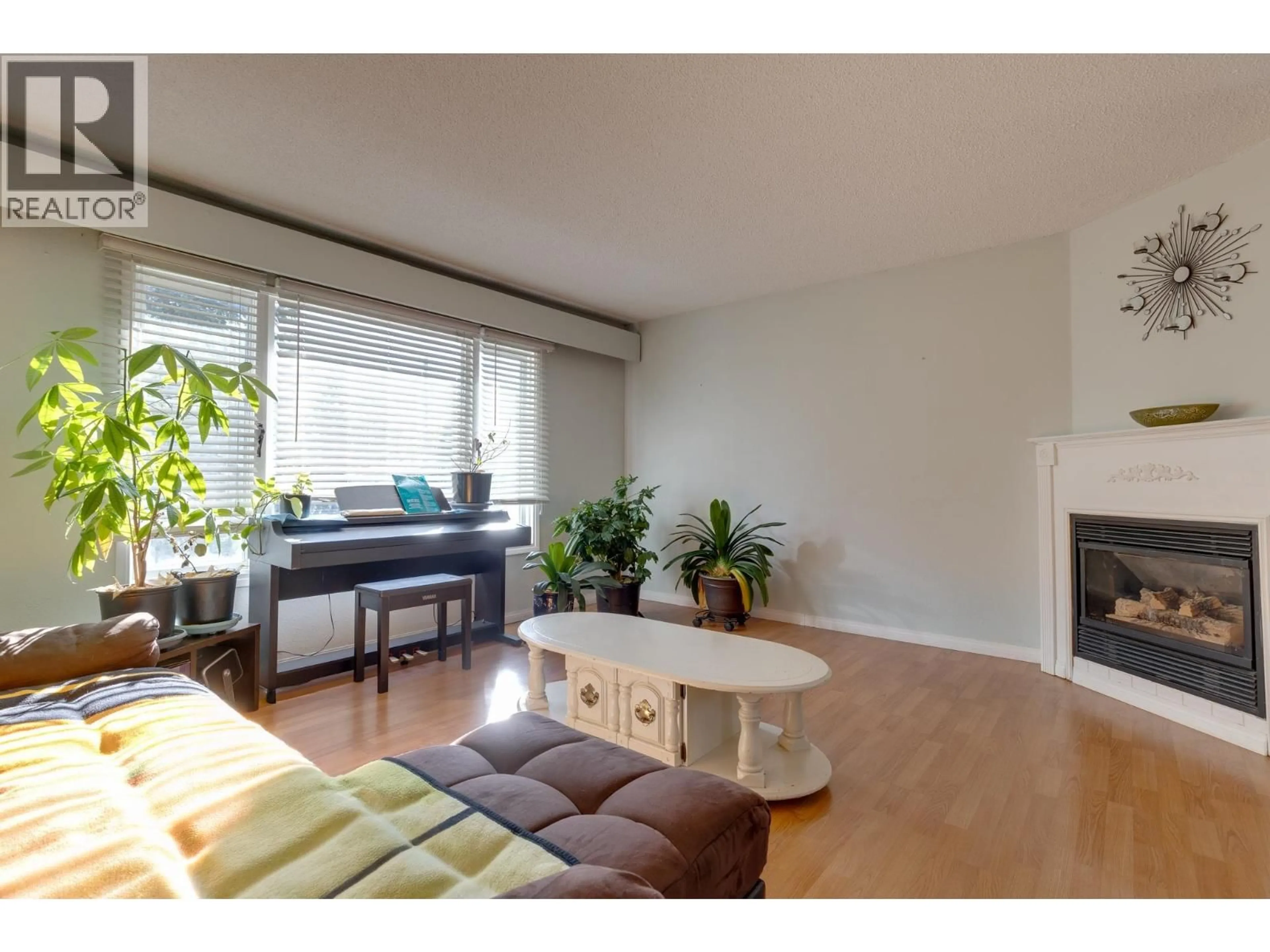 Living room with furniture, wood/laminate floor for 7287 ALDEEN ROAD, Prince George British Columbia V2N5P8
