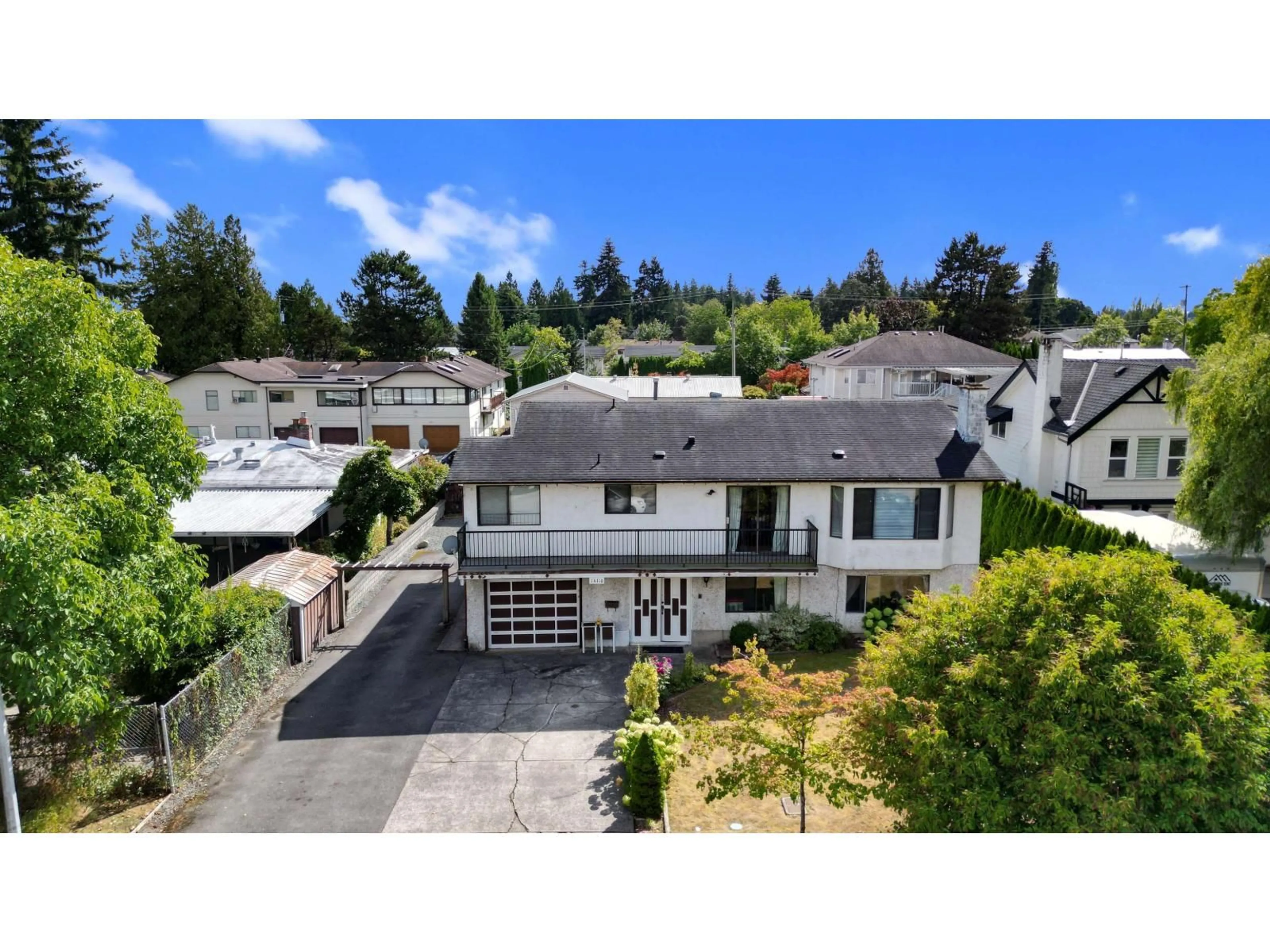 A pic from outside/outdoor area/front of a property/back of a property/a pic from drone, street for 14110 72A AVENUE, Surrey British Columbia V3W7M7