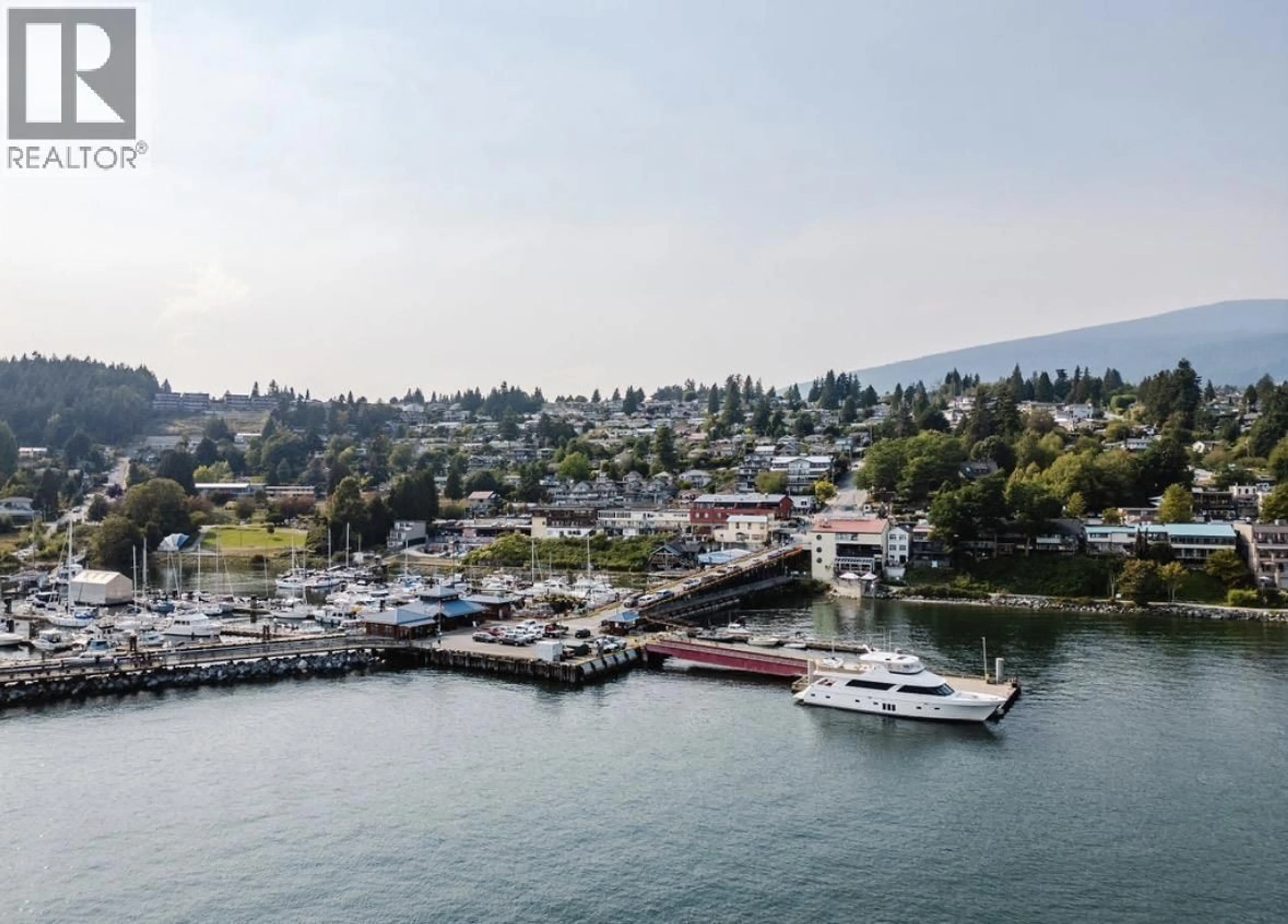 A pic from outside/outdoor area/front of a property/back of a property/a pic from drone, water/lake/river/ocean view for 102 - 524 FLETCHER ROAD, Gibsons British Columbia V0N1V0