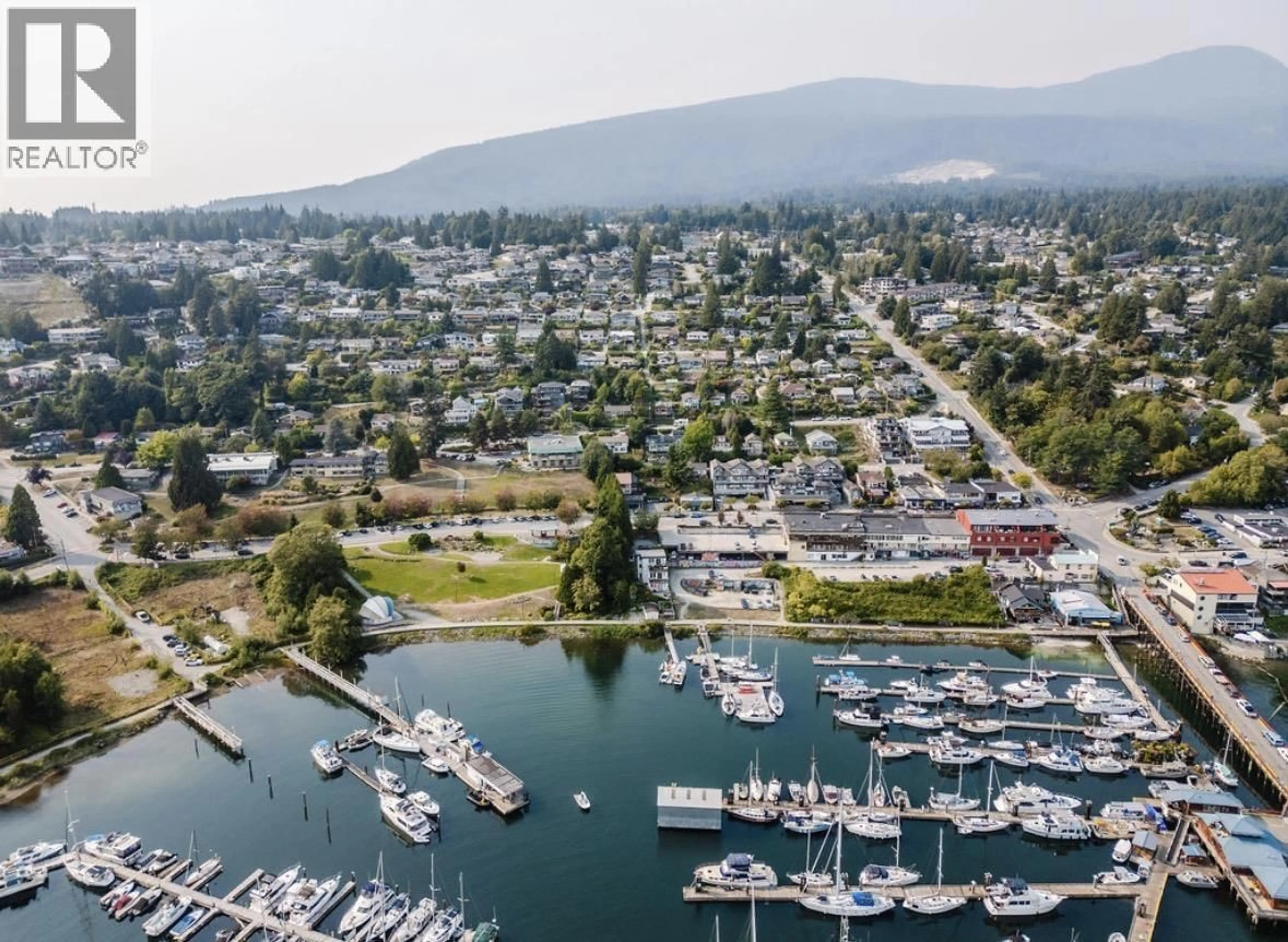 A pic from outside/outdoor area/front of a property/back of a property/a pic from drone, water/lake/river/ocean view for 102 - 524 FLETCHER ROAD, Gibsons British Columbia V0N1V0