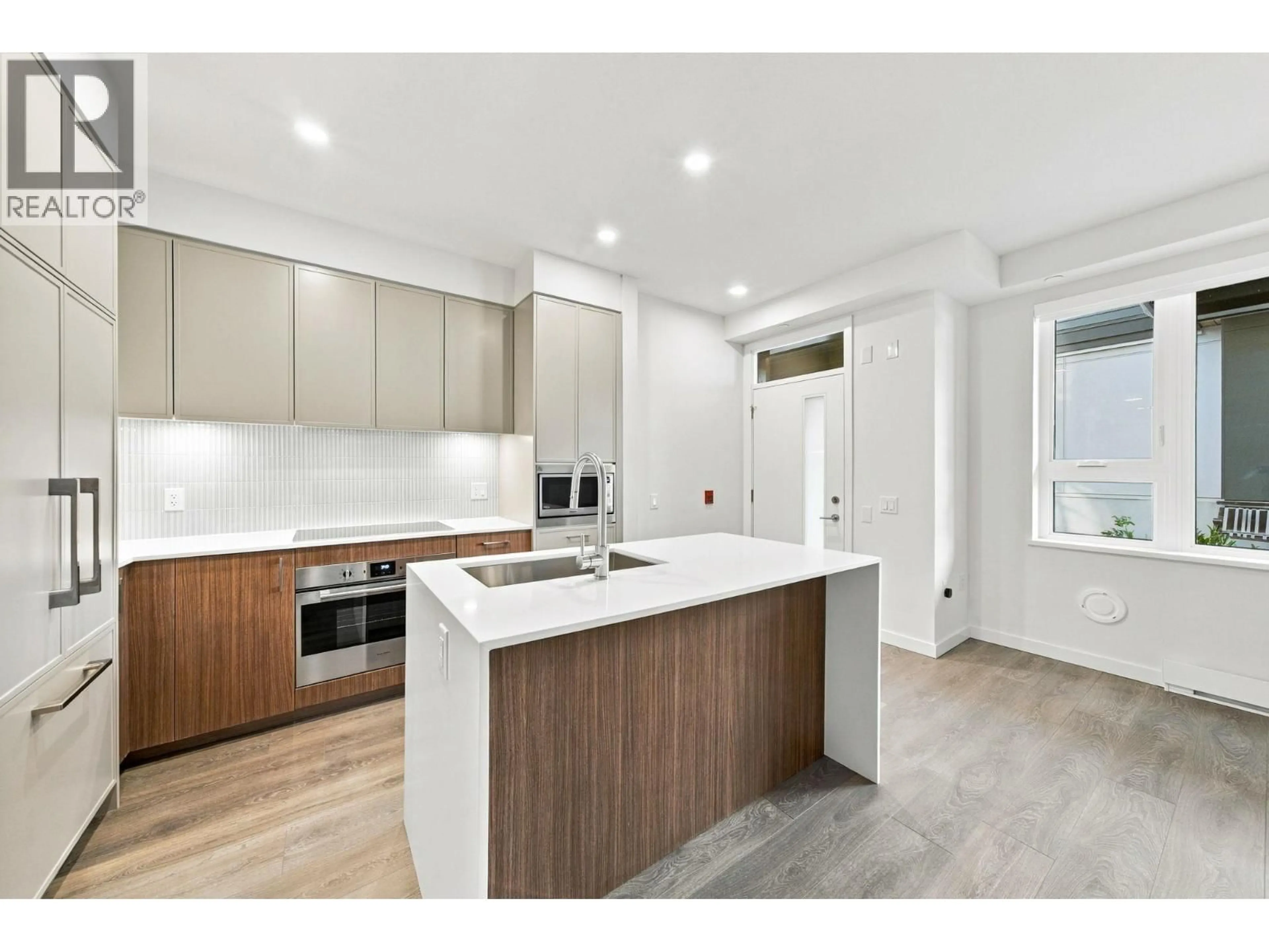 Open concept kitchen, unknown for 102 - 956 LYTTON STREET, North Vancouver British Columbia V7H0C4