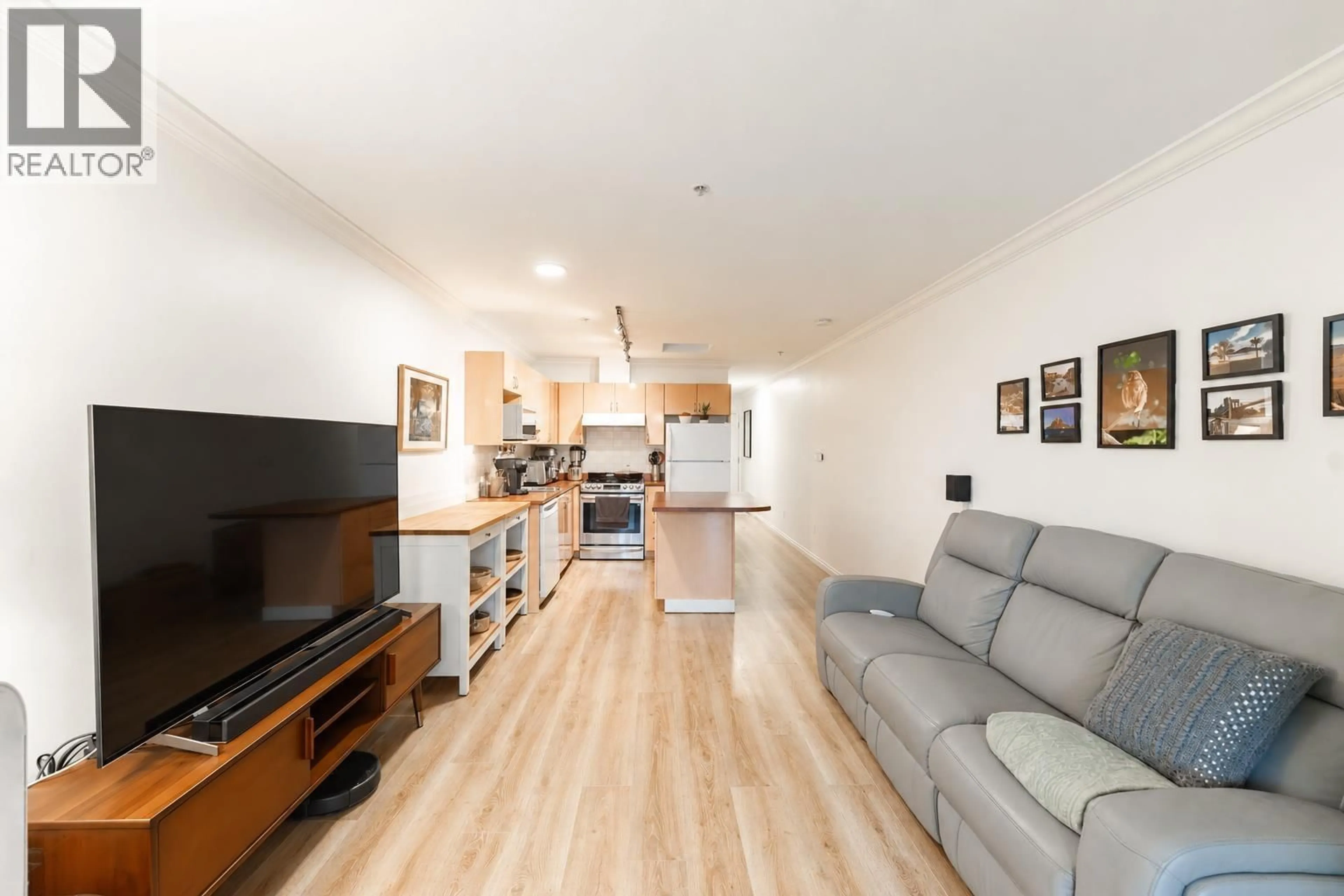 Living room with furniture, wood/laminate floor for 406 - 5629 DUNBAR STREET, Vancouver British Columbia V6N1W5