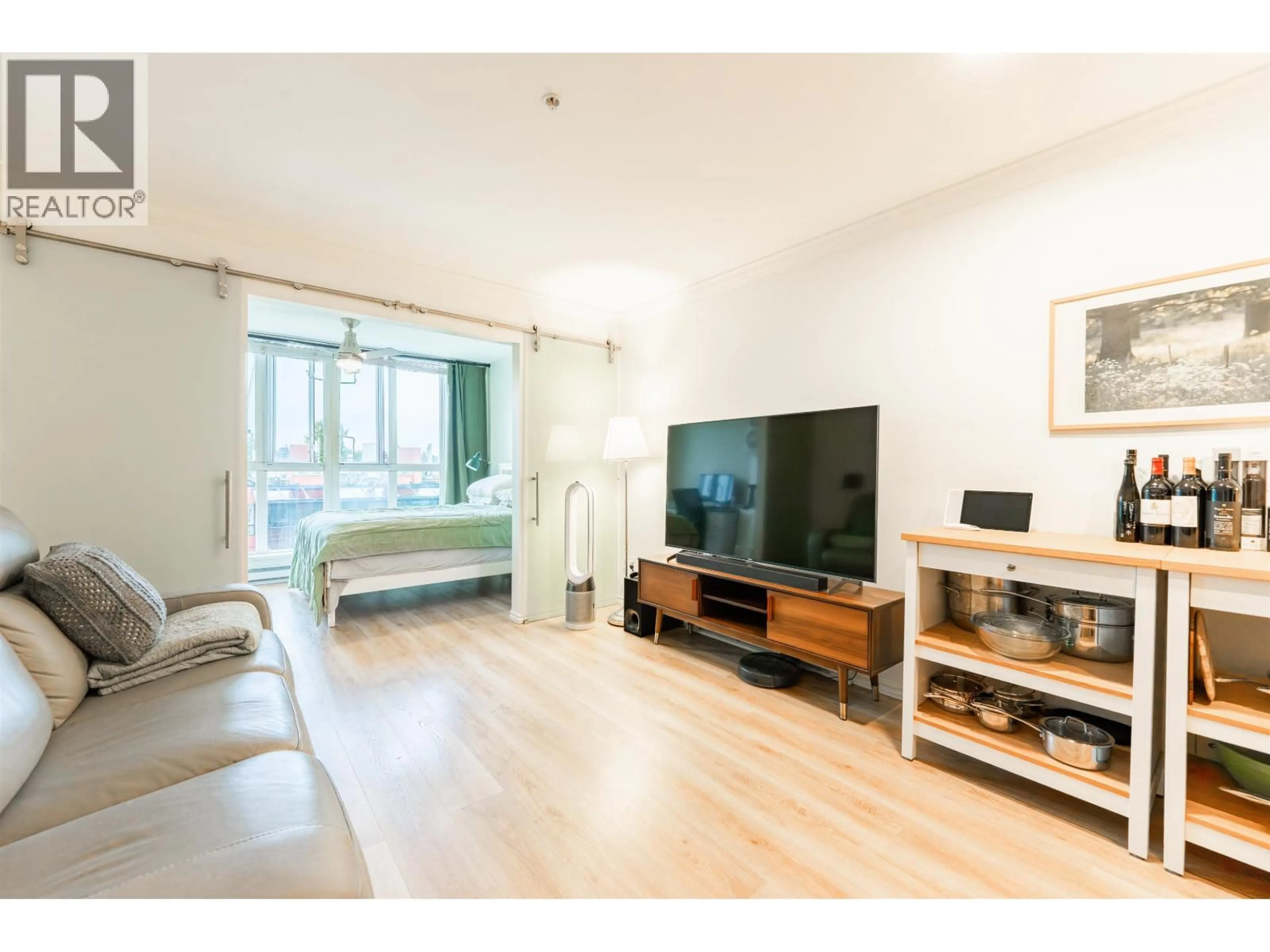 Living room with furniture, wood/laminate floor for 406 - 5629 DUNBAR STREET, Vancouver British Columbia V6N1W5