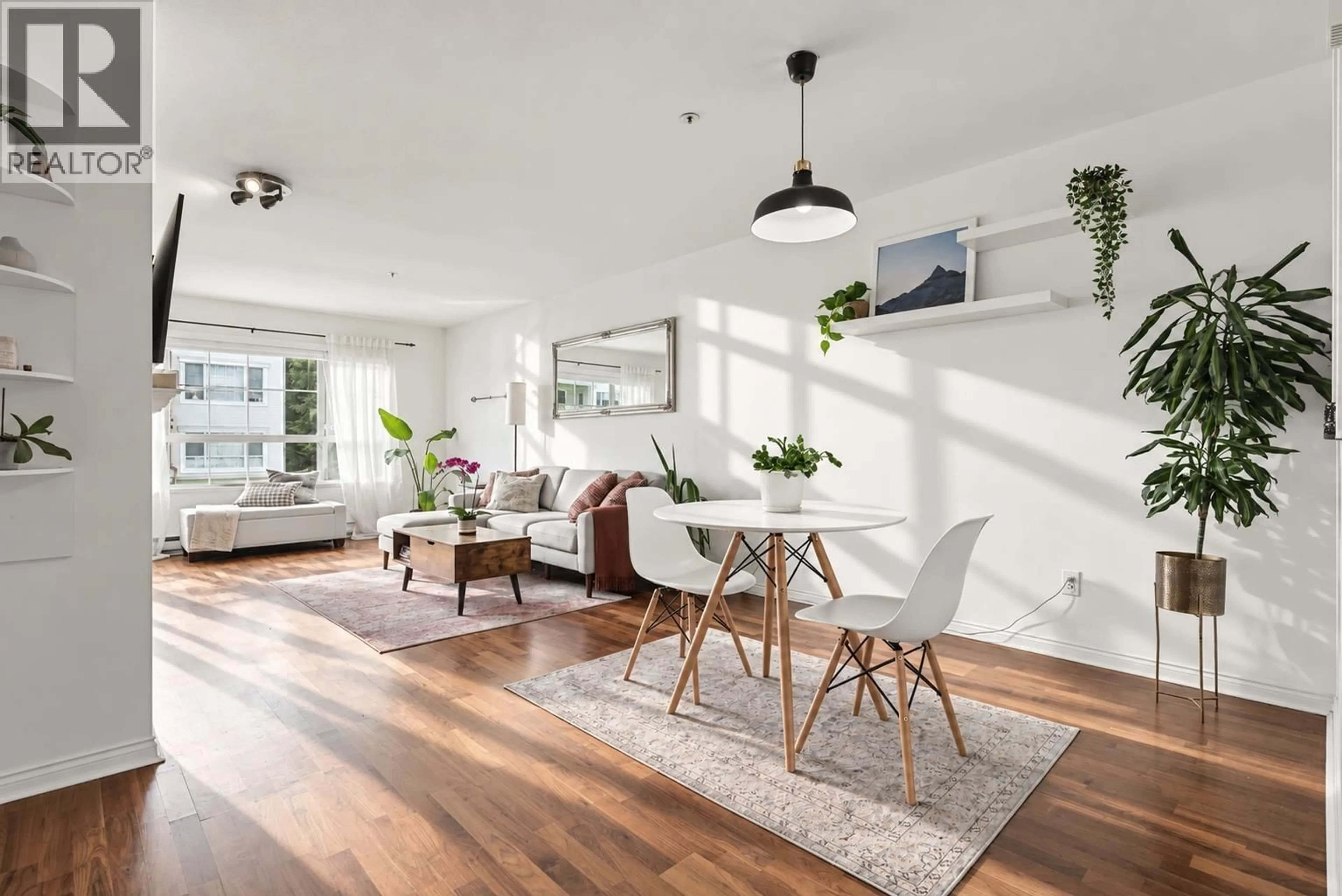 Living room with furniture, wood/laminate floor for 205 - 2975 PRINCESS CRESCENT, Coquitlam British Columbia V3B7N3