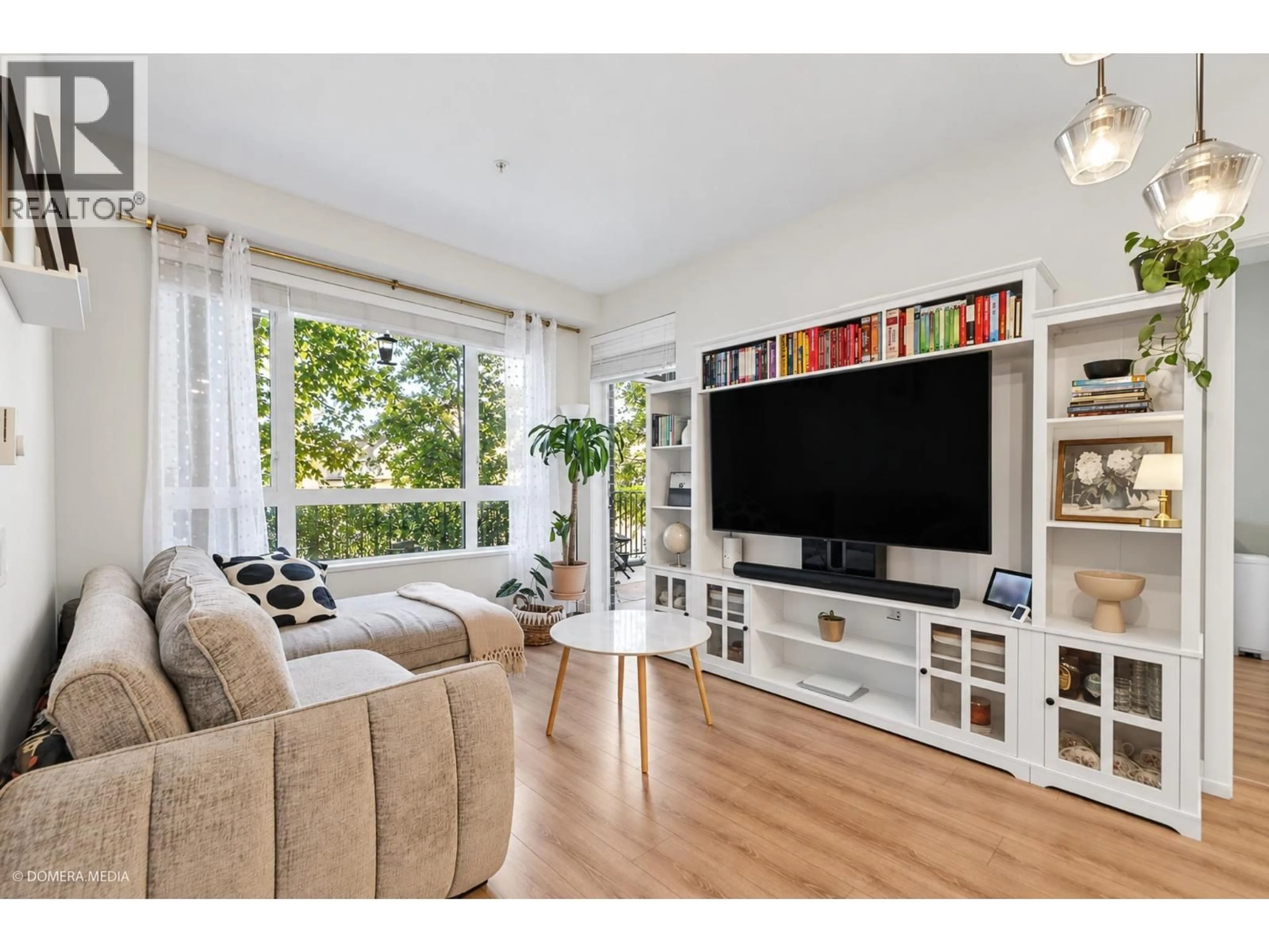 Living room with furniture, wood/laminate floor for 110 - 721 ANSKAR COURT, Coquitlam British Columbia V3J0L4