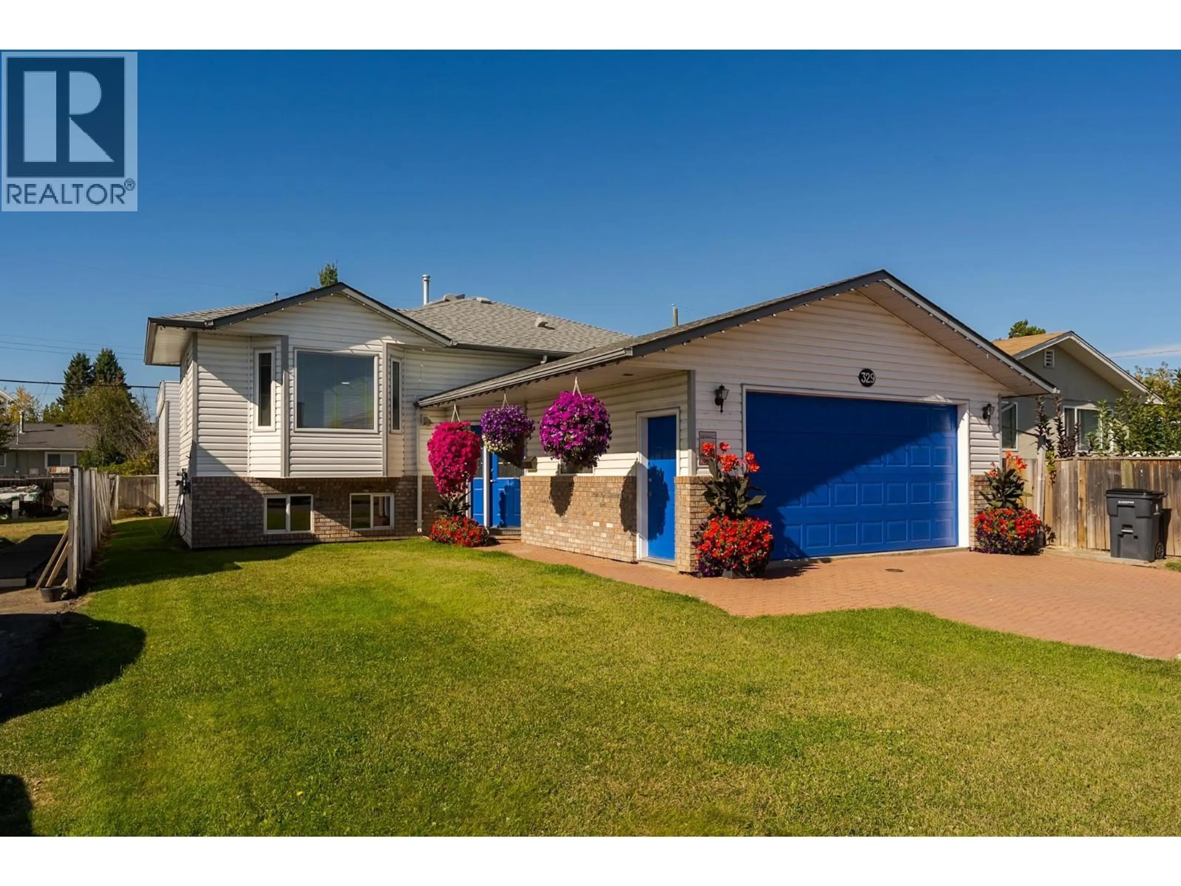 Home with vinyl exterior material, street for 329 IRWIN STREET, Prince George British Columbia V2M2X4