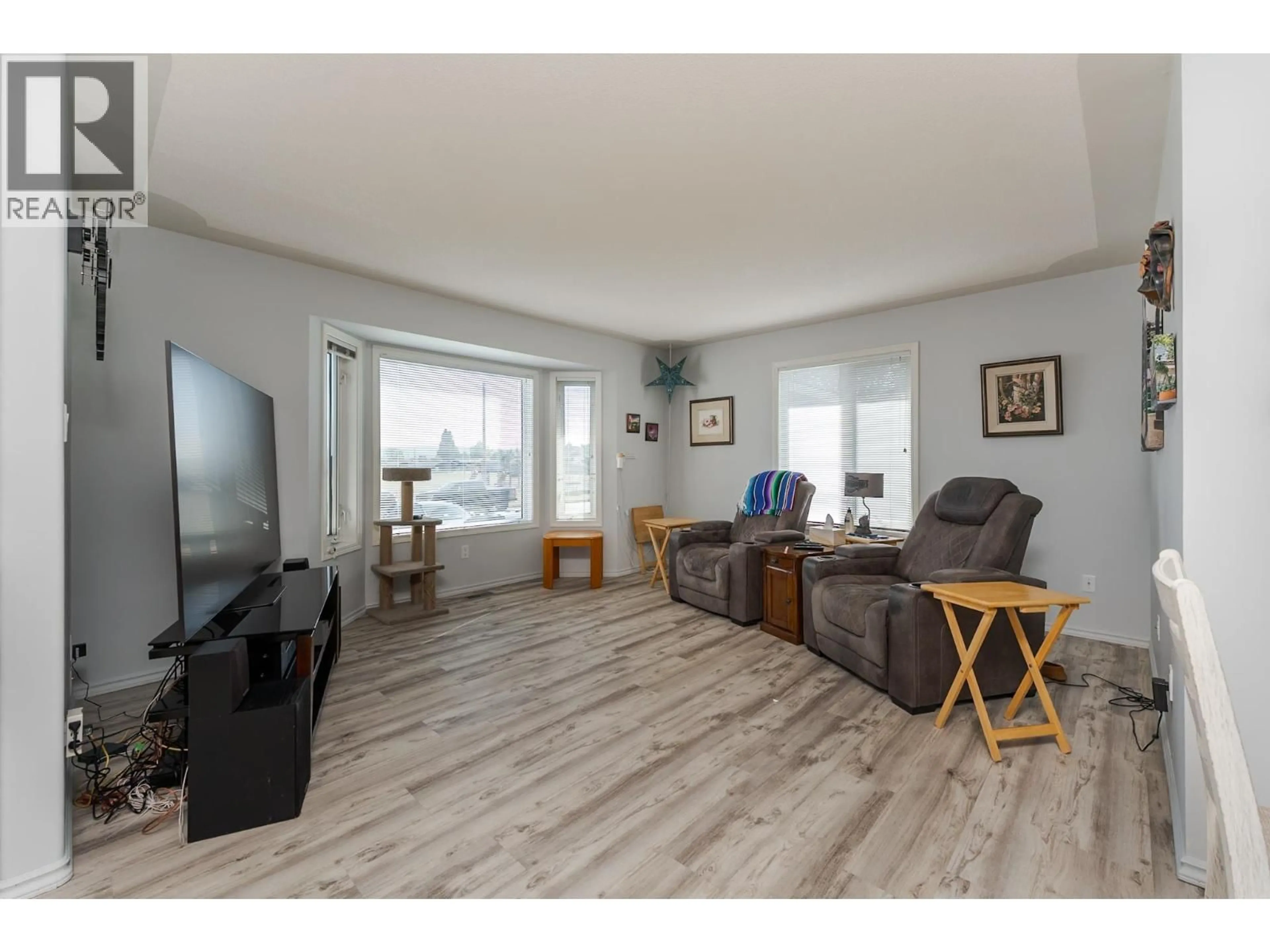 Living room with furniture, wood/laminate floor for 329 IRWIN STREET, Prince George British Columbia V2M2X4