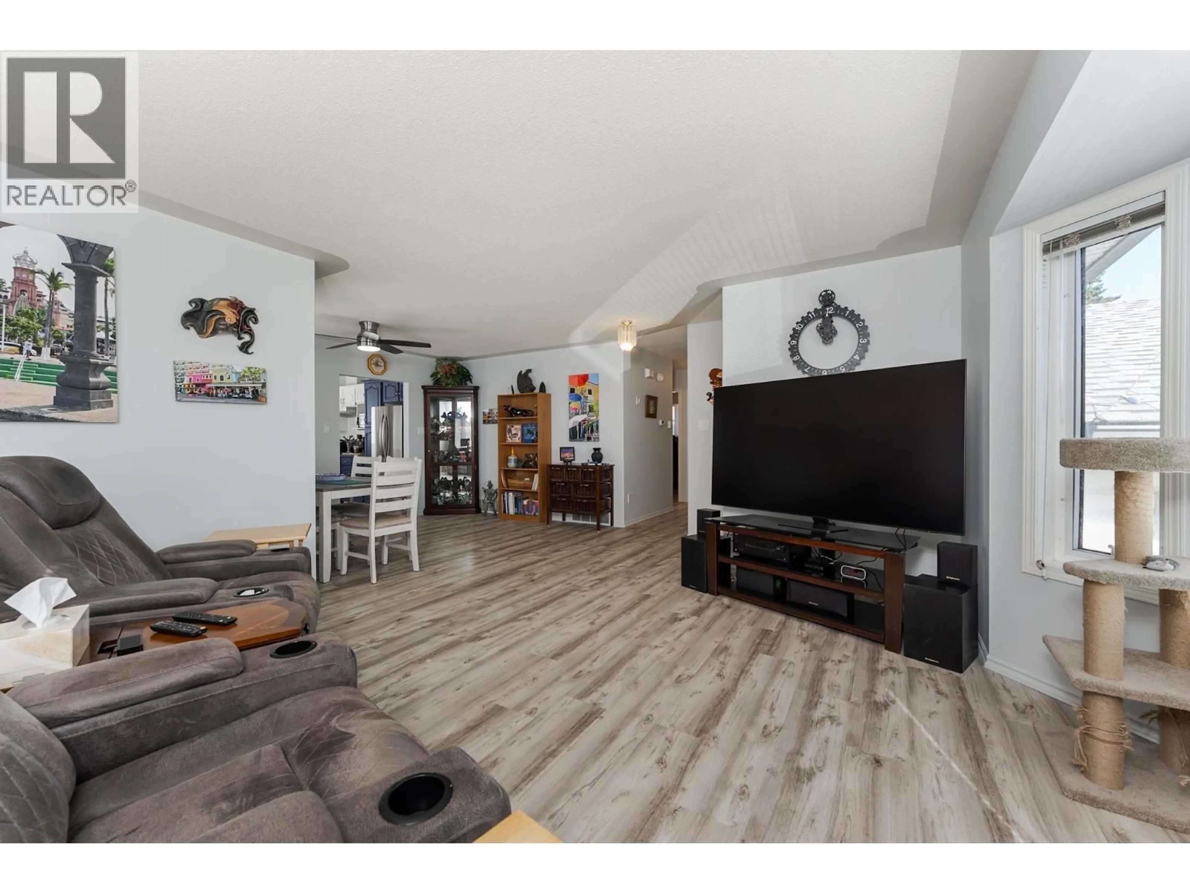 Living room with furniture, wood/laminate floor for 329 IRWIN STREET, Prince George British Columbia V2M2X4
