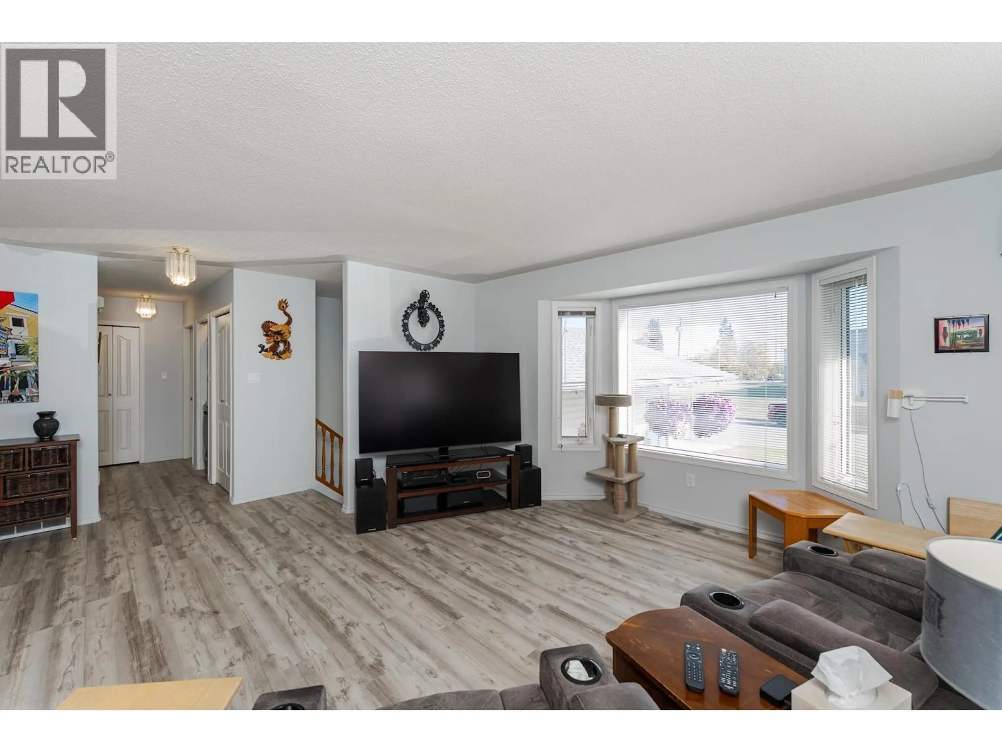 Living room with furniture, wood/laminate floor for 329 IRWIN STREET, Prince George British Columbia V2M2X4