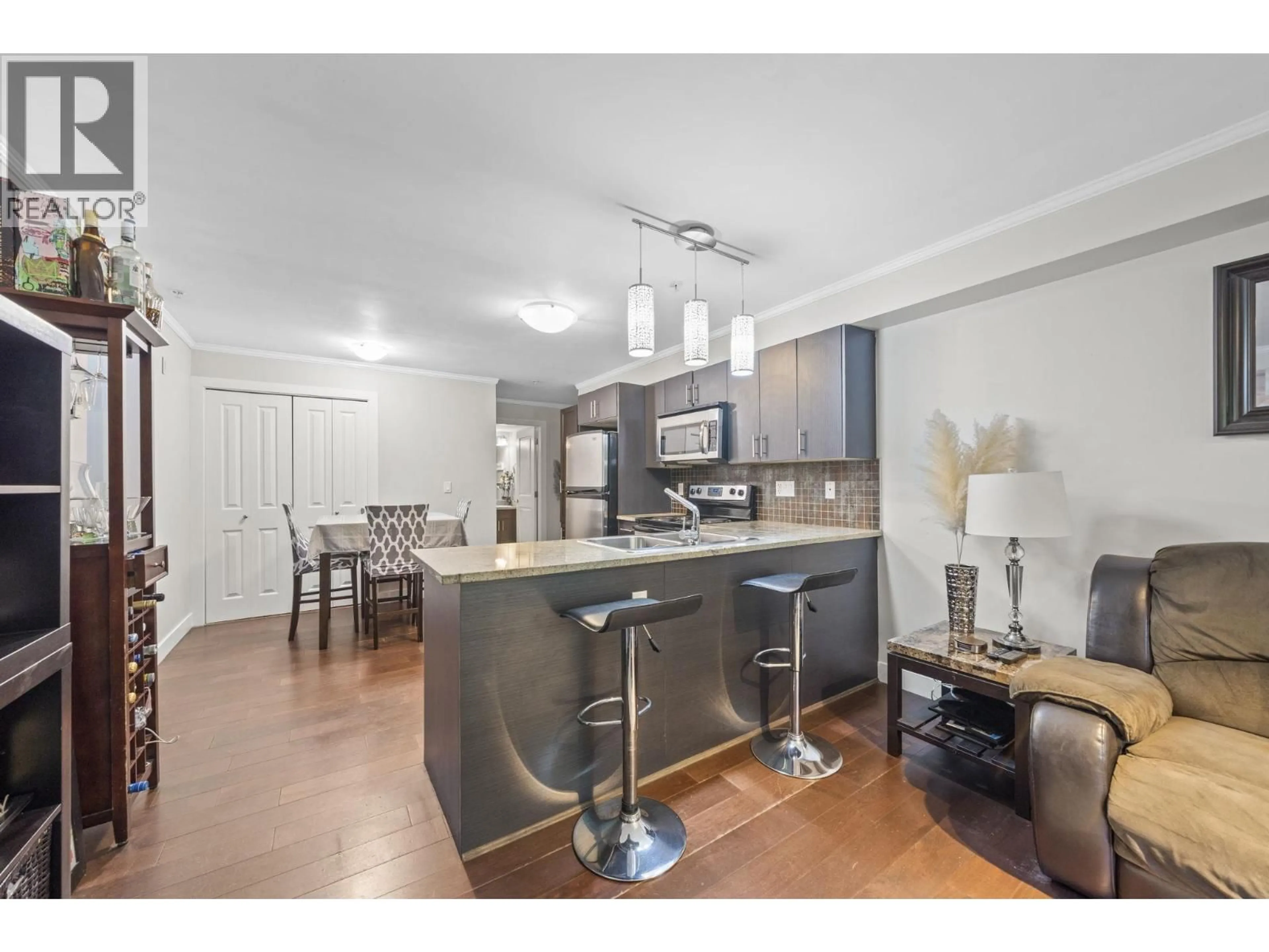 Open concept kitchen, wood/laminate floor for 102 - 2228 WELCHER AVENUE, Port Coquitlam British Columbia V3C1X3