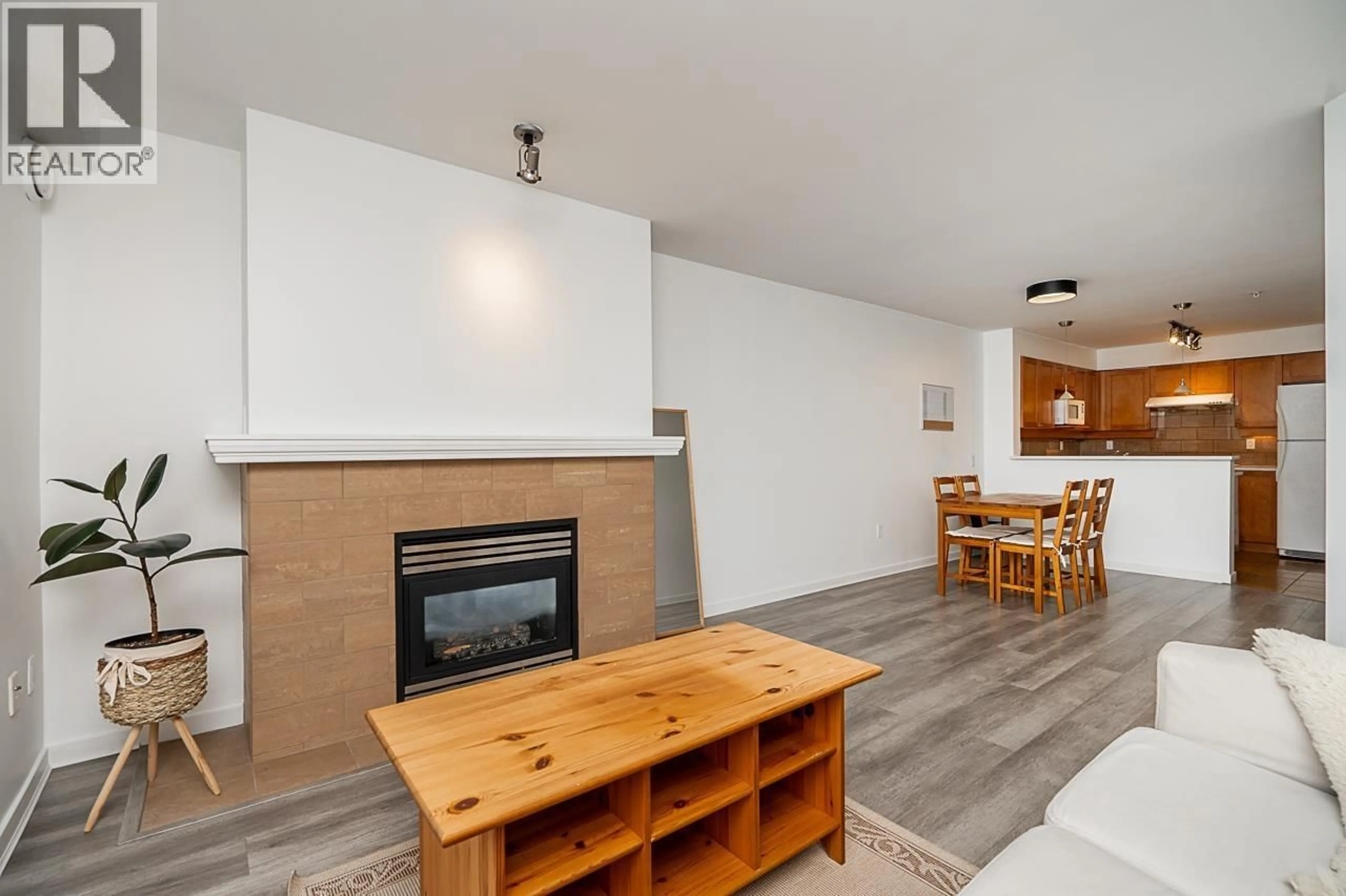 Living room with furniture, wood/laminate floor for 306 - 3580 41ST AVENUE, Vancouver British Columbia V6N3E6