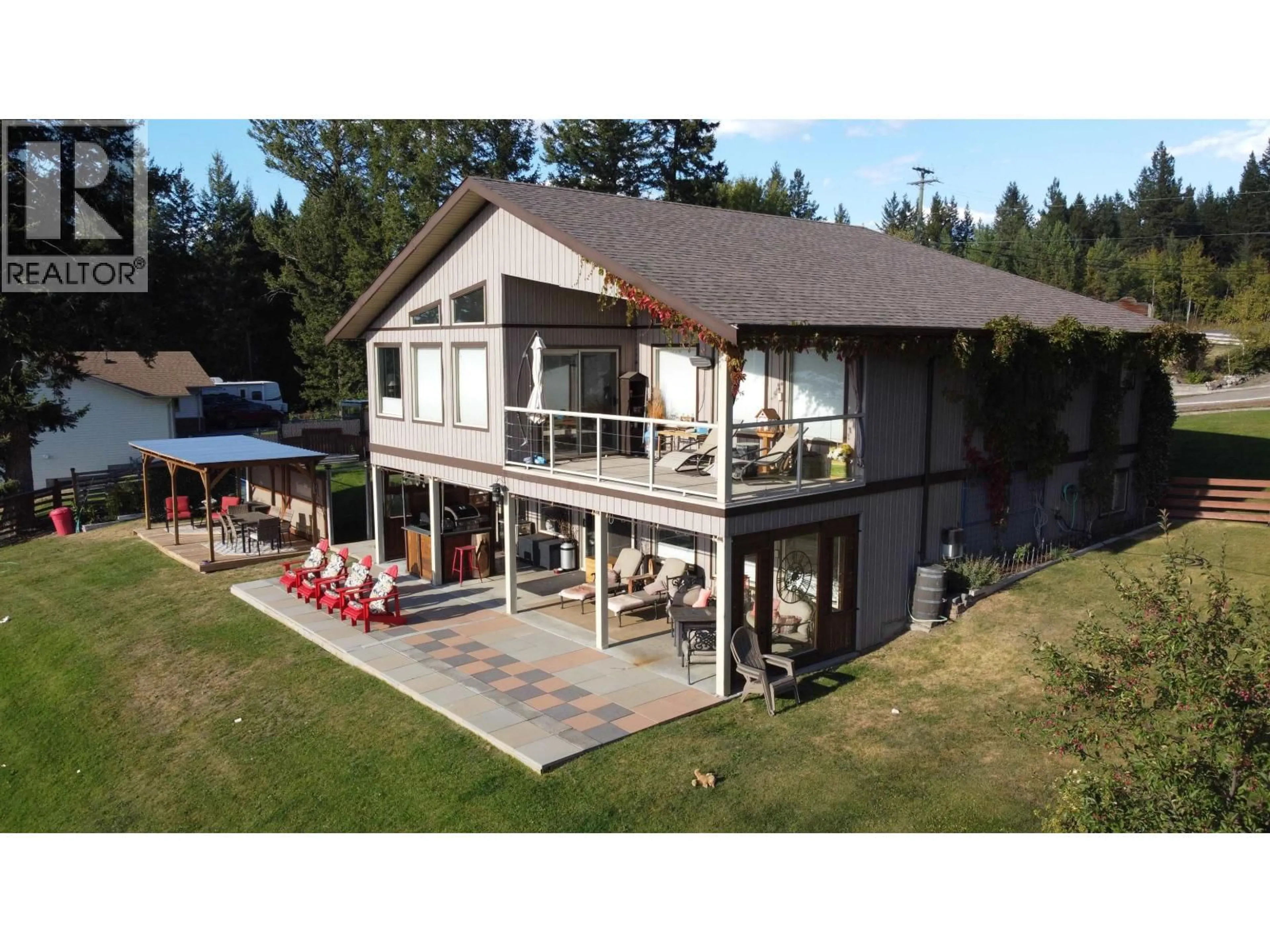 A pic from outside/outdoor area/front of a property/back of a property/a pic from drone, building for 4782 TELQUA DRIVE, 108 Mile Ranch British Columbia V0K2Z0