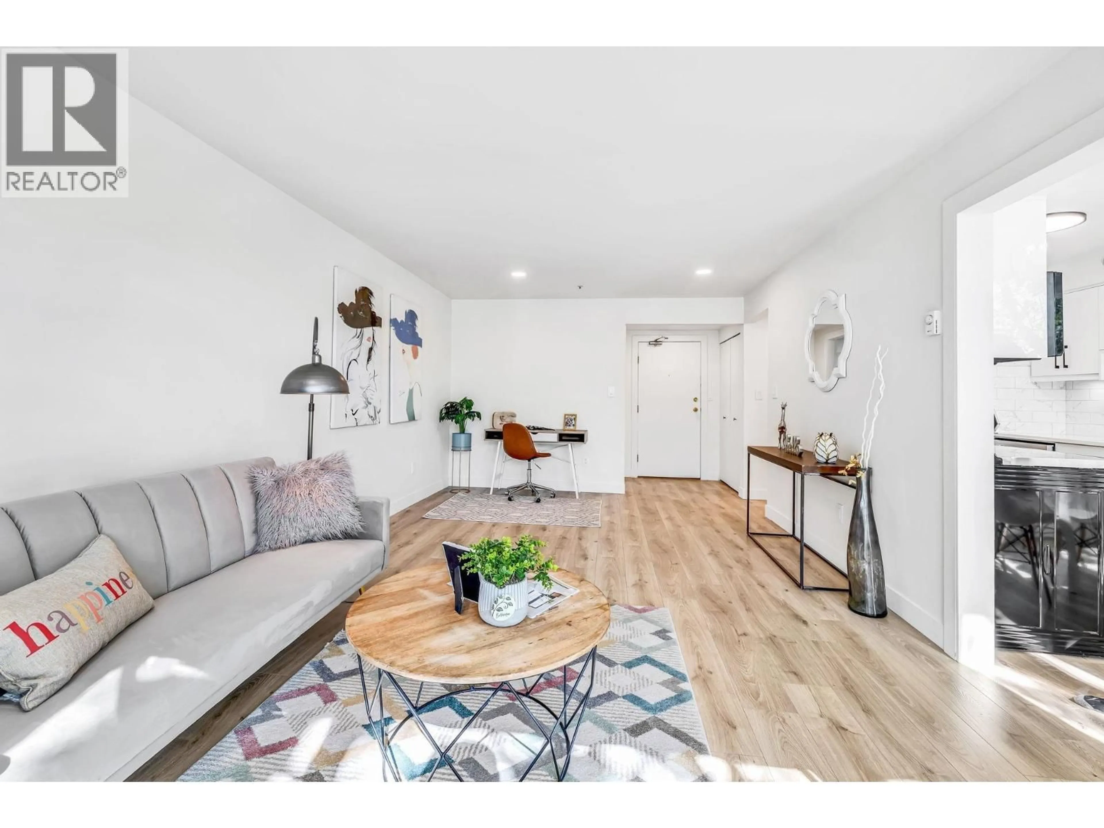 Living room with furniture, wood/laminate floor for 105 - 7700 GILBERT ROAD, Richmond British Columbia V7C3W2