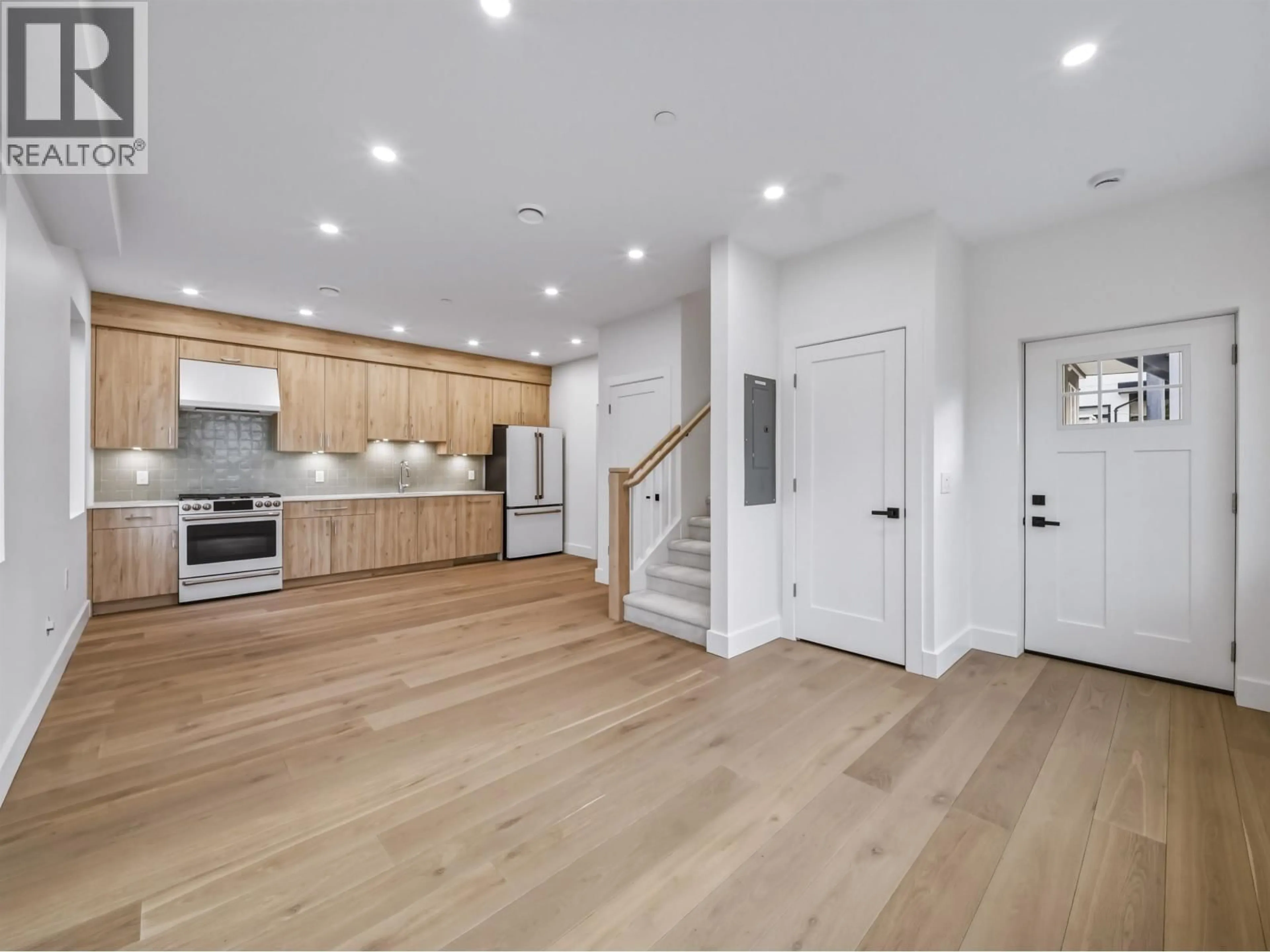 Open concept kitchen, wood/laminate floor for 2 - 2339 PARKER STREET, Vancouver British Columbia V5L2M2