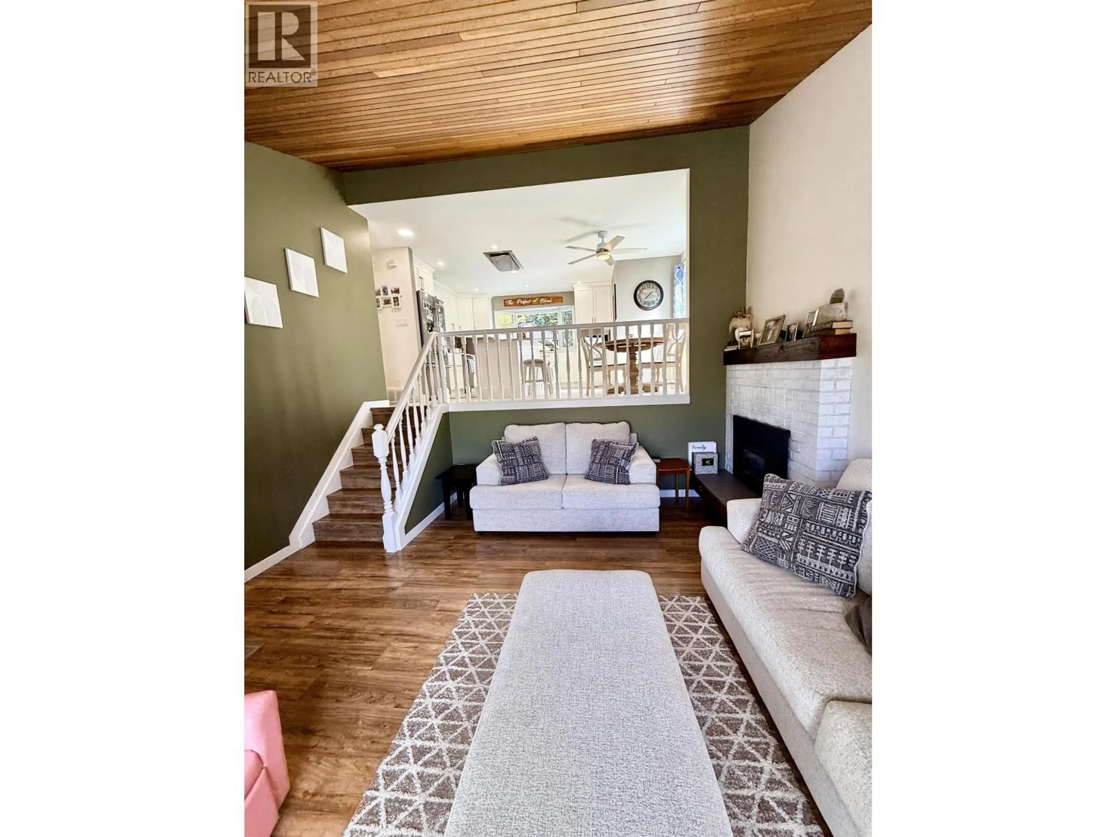 Living room with furniture, wood/laminate floor for 2838 INGALA DRIVE, Prince George British Columbia V2K3Z8