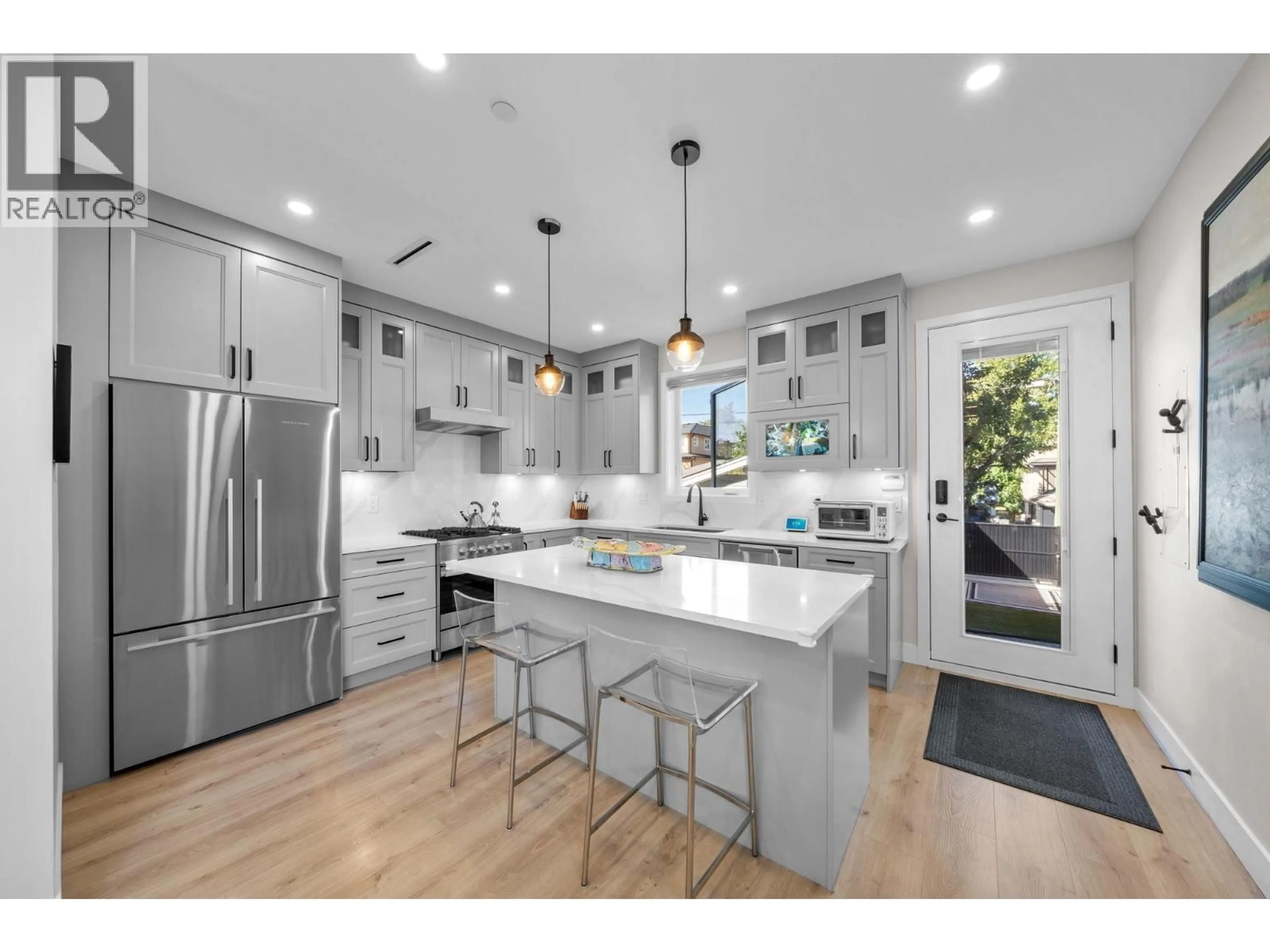 Contemporary kitchen, wood/laminate floor for 1 - 2749 54TH AVENUE, Vancouver British Columbia V5S1X7