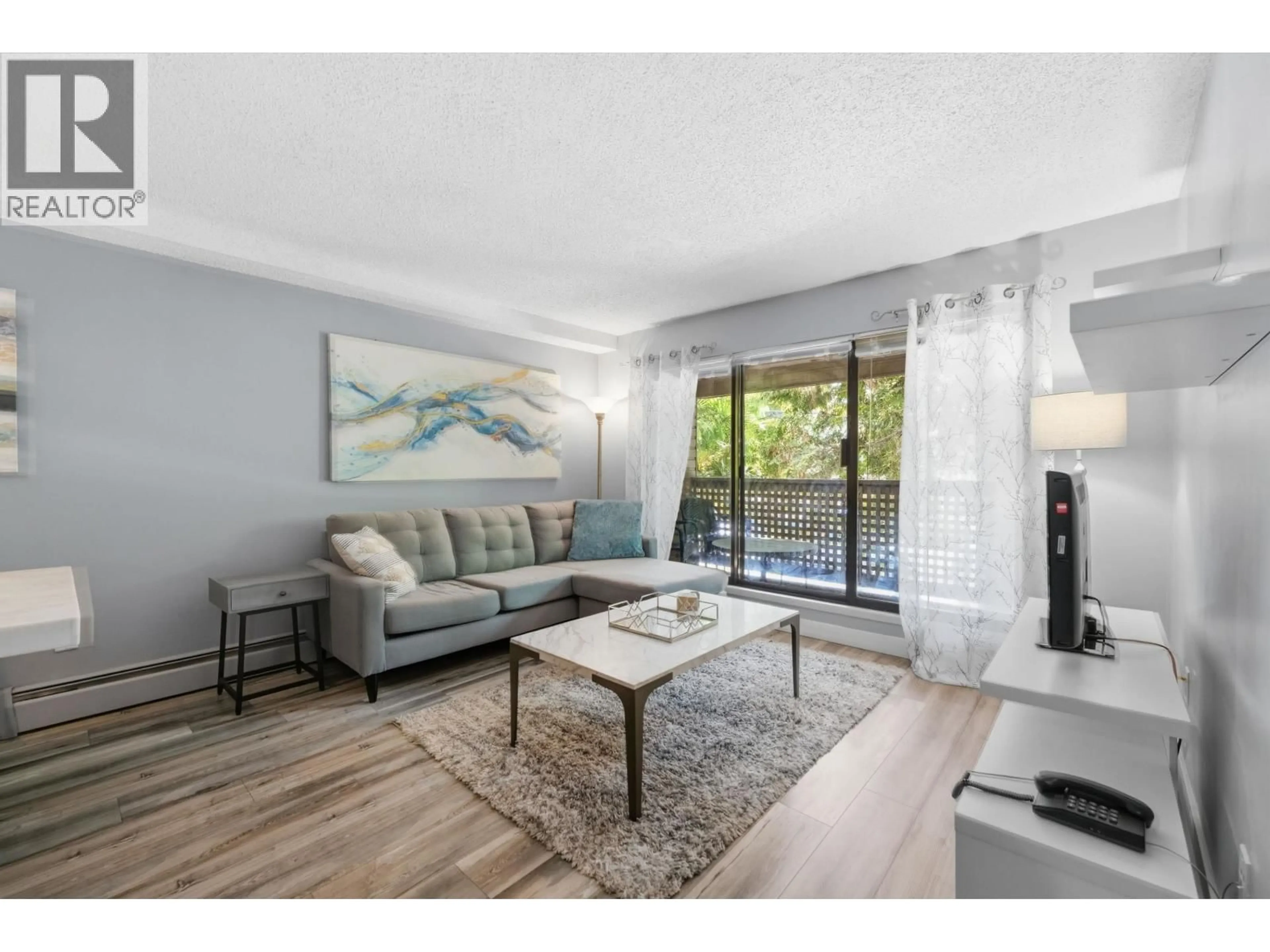 Living room with furniture, unknown for 106 - 423 AGNES STREET, New Westminster British Columbia V3L1G2