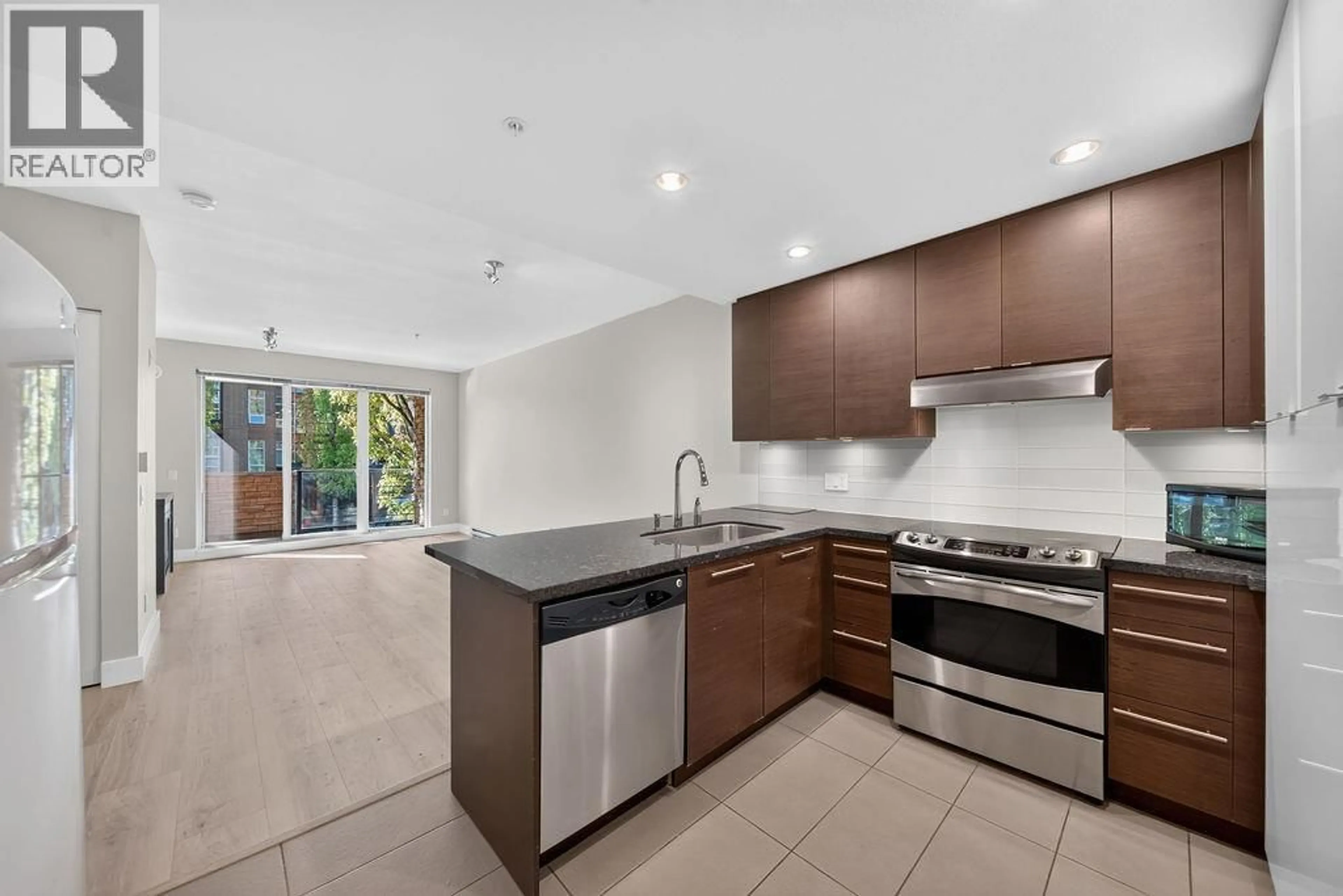 Open concept kitchen, ceramic/tile floor for 208 - 3478 WESBROOK MALL, Vancouver British Columbia V6S0B6