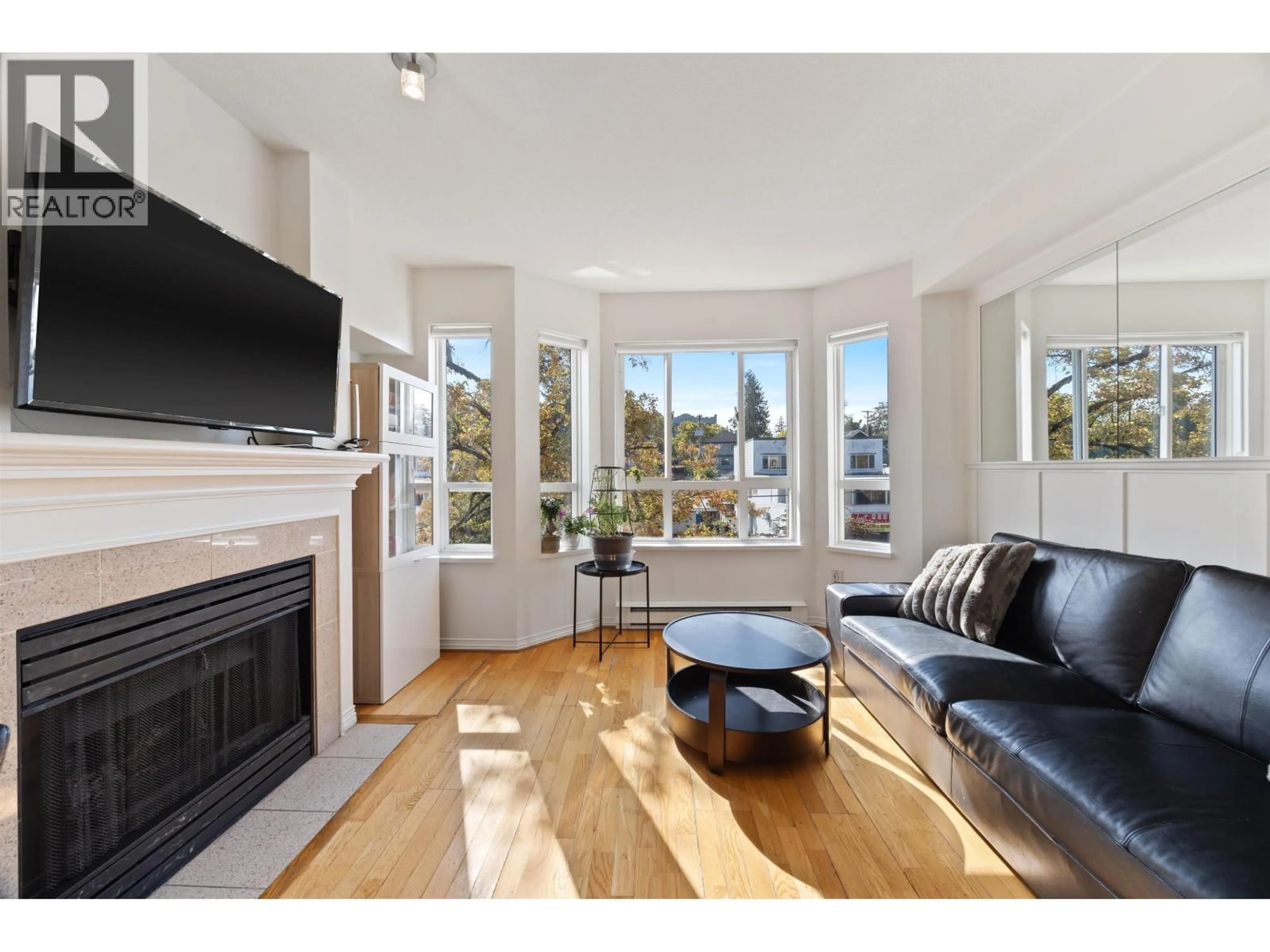 Living room with furniture, wood/laminate floor for 316 - 2565 BROADWAY STREET, Vancouver British Columbia V6K2E9