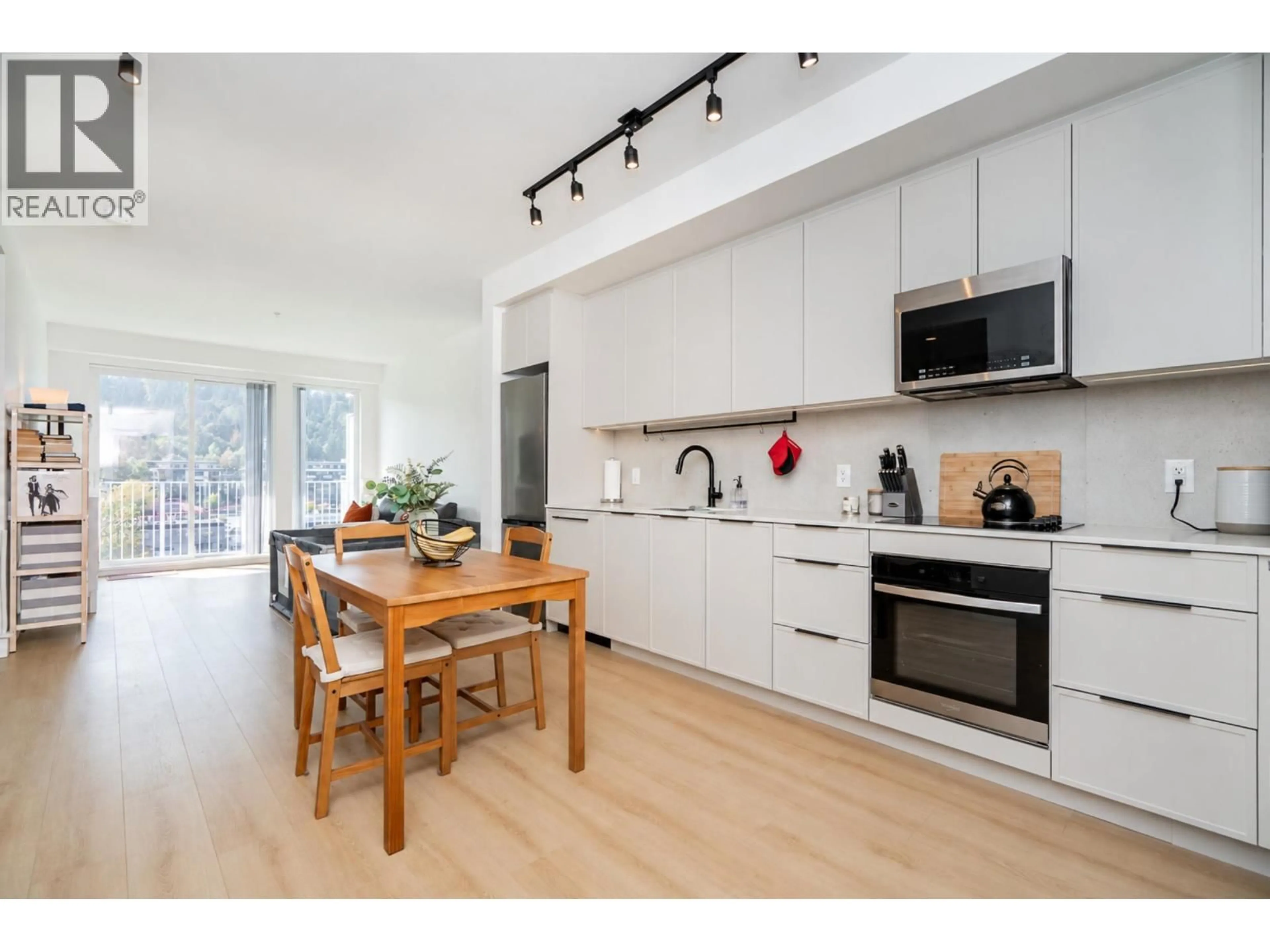 Open concept kitchen, wood/laminate floor for 603 - 3055 MURRAY STREET, Port Moody British Columbia V3H0P4