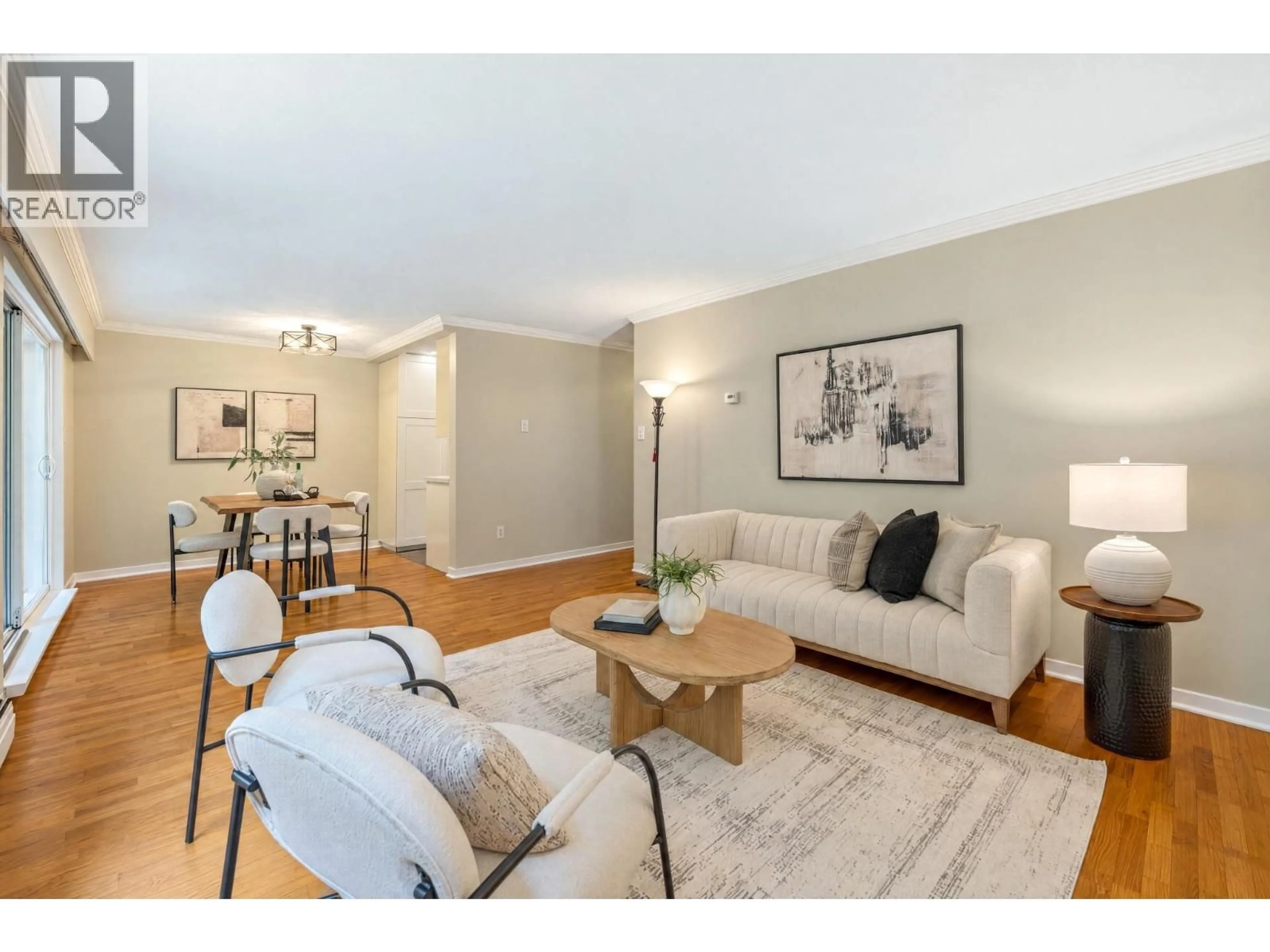 Living room with furniture, wood/laminate floor for 403 - 555 28TH STREET, North Vancouver British Columbia V7N2J7