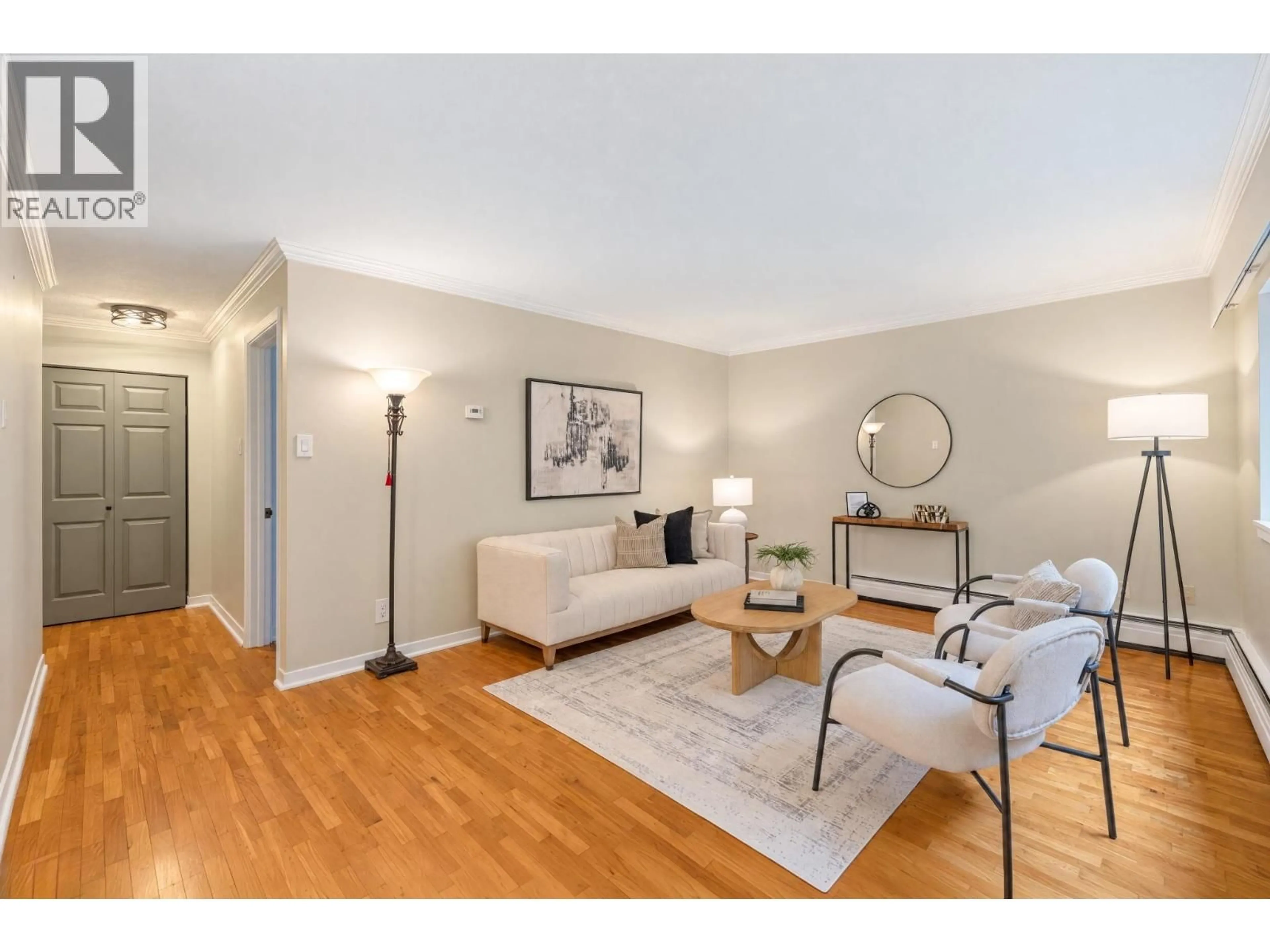 Living room with furniture, wood/laminate floor for 403 - 555 28TH STREET, North Vancouver British Columbia V7N2J7