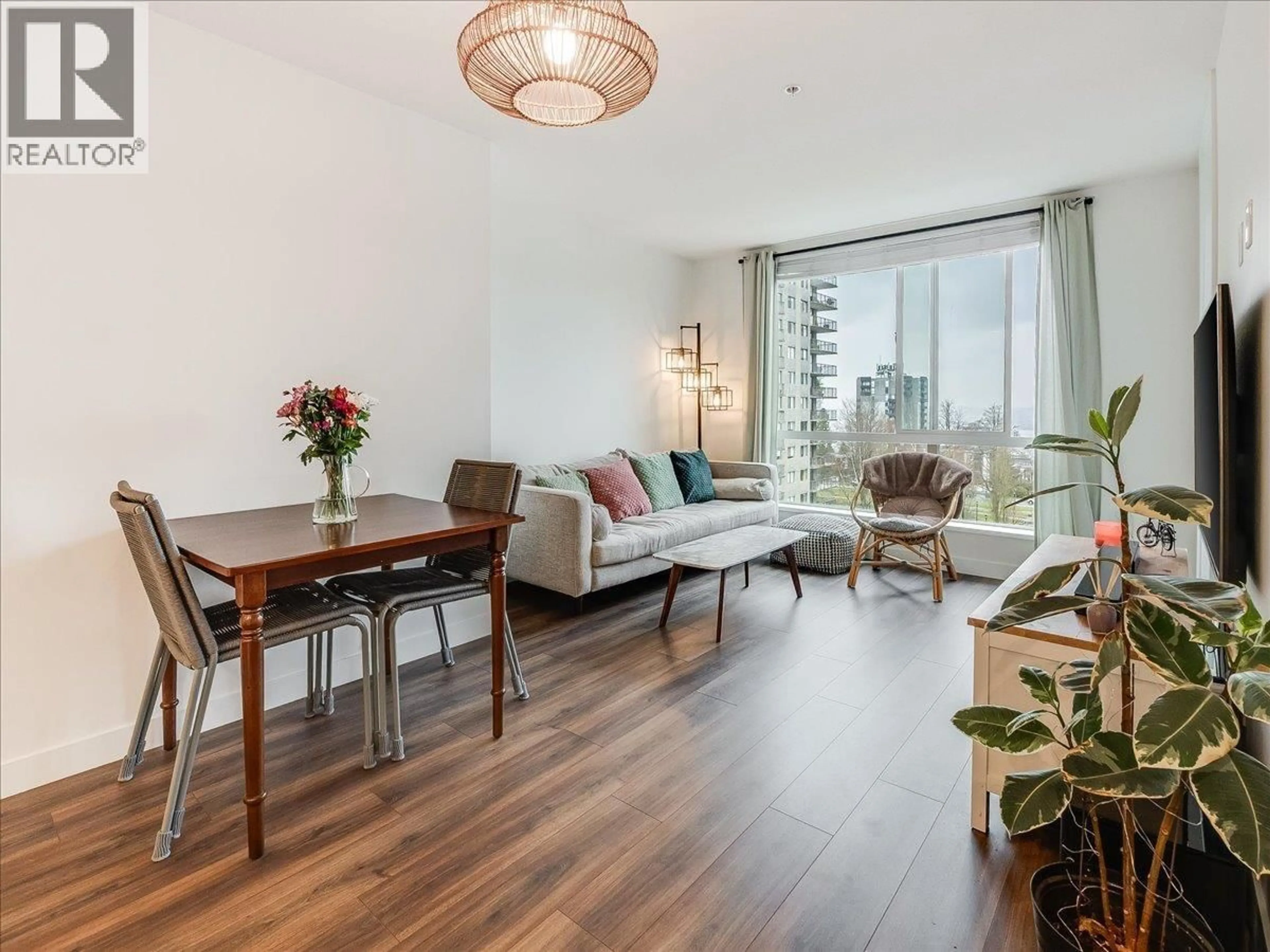 Living room with furniture, wood/laminate floor for 406 - 108 8TH STREET, North Vancouver British Columbia V7L0H1